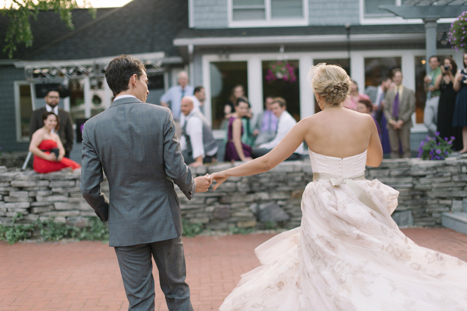 Bride and groom share a choreographed first dance during their wedding reception at Tapawingo in Northern Michigan by Ann Arbor Wedding Photographer Heather Jowett.