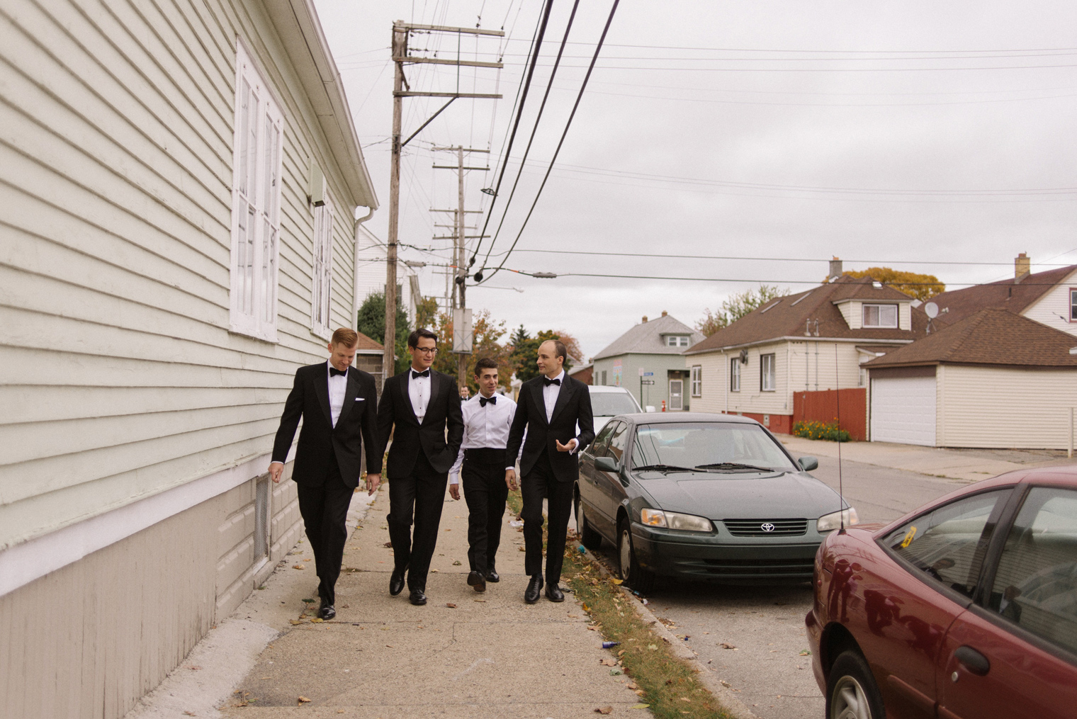 The groom and his groomsmen head to the wedding ceremony on a Detroit wedding day by photographer Heather Jowett.