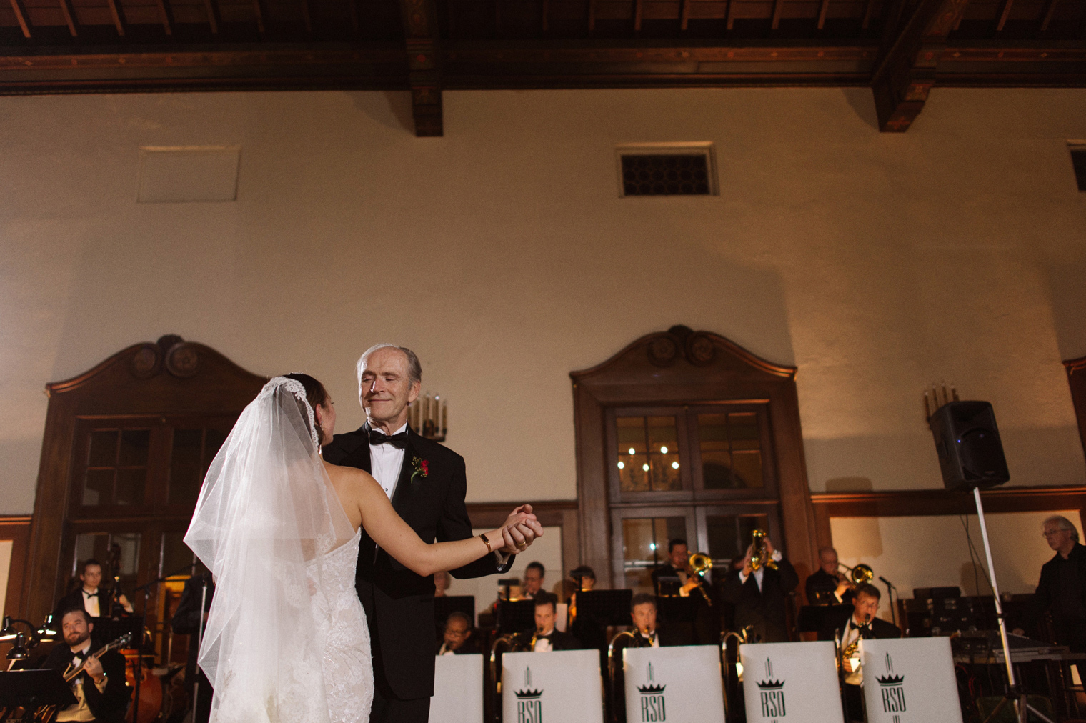 A bride shares a dance with her father at her Detroit Yacht Club wedding by photographer Heather Jowett.