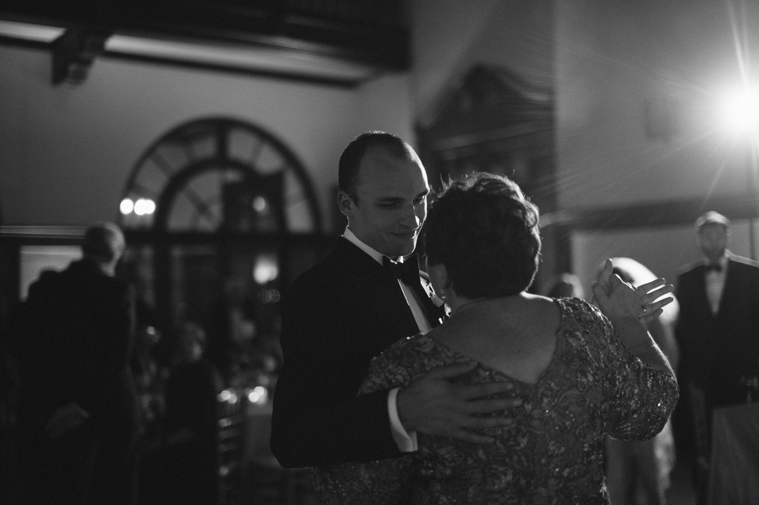 The groom shares a dance with his mother at his Detroit Yacht Club wedding by photographer Heather Jowett.