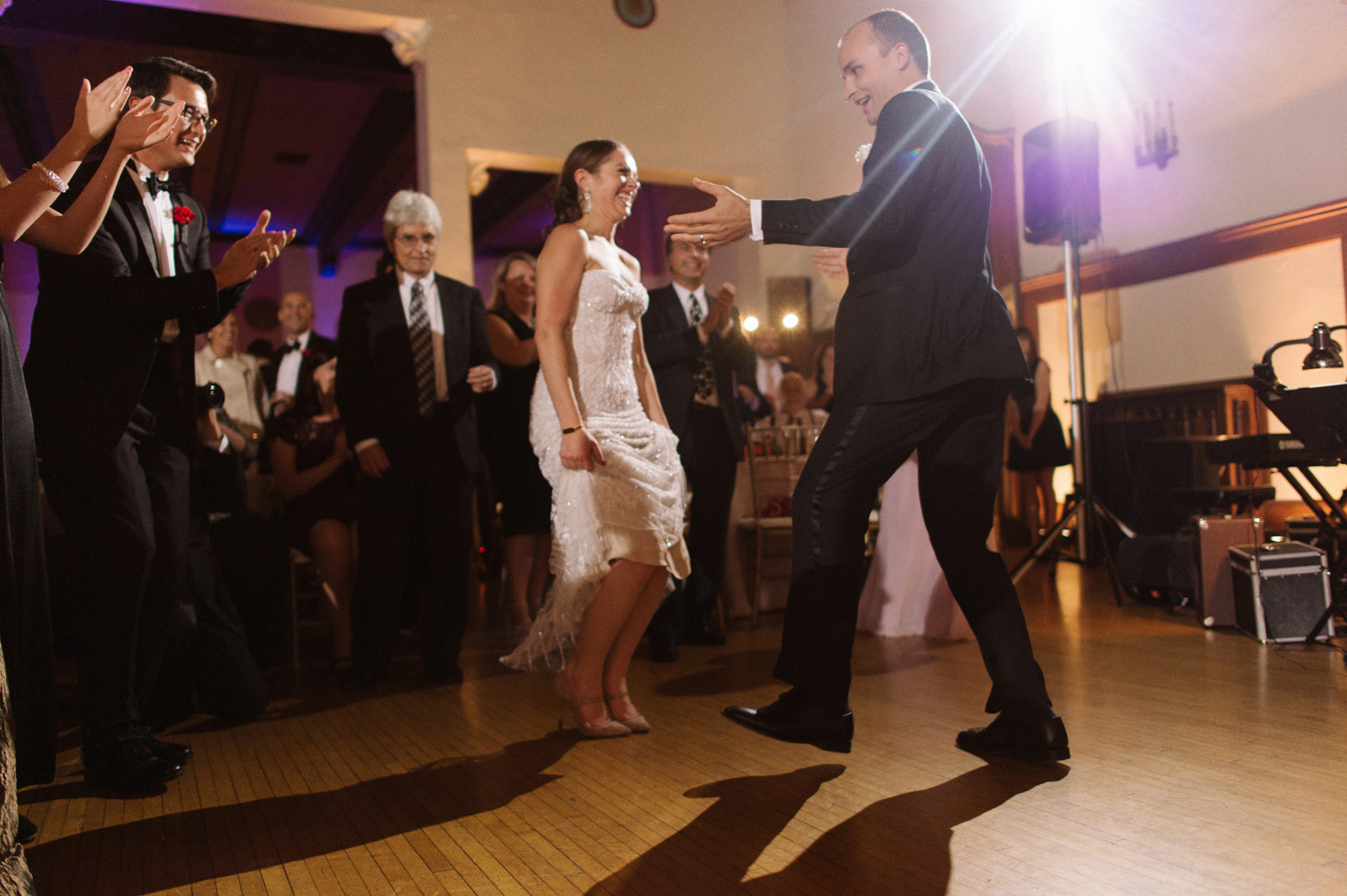 The bride, groom, and guests do traditional Ukrainian dances at a Detroit Yacht Club wedding by Michigan Photographer Heather Jowett.