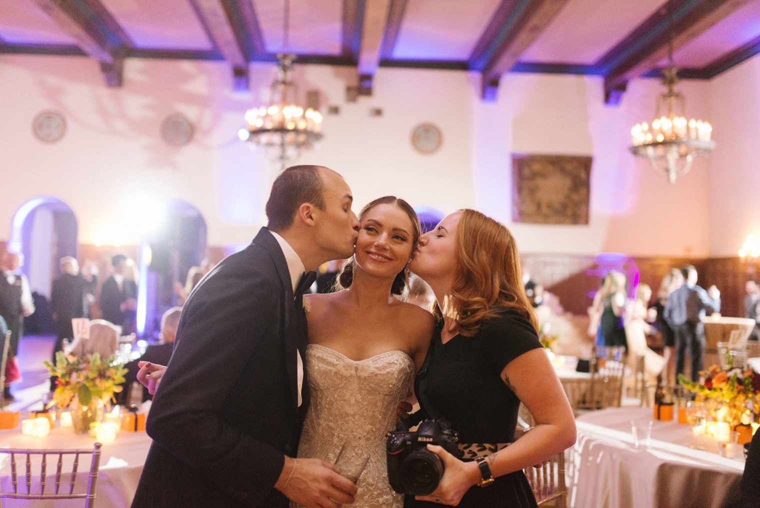 Wedding Photographer Heather Jowett poses with her bride and groom at a Detroit Yacht Club wedding.
