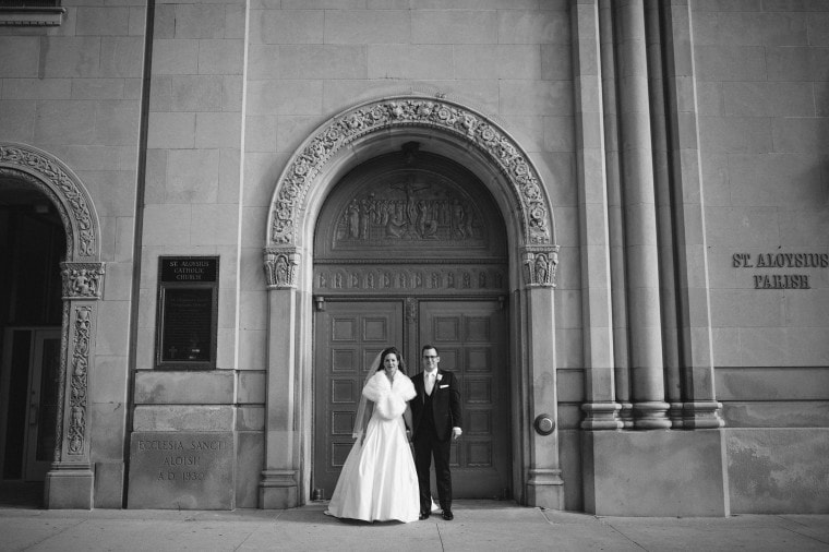 The bride and groom pose for portraits before their Detroit wedding.