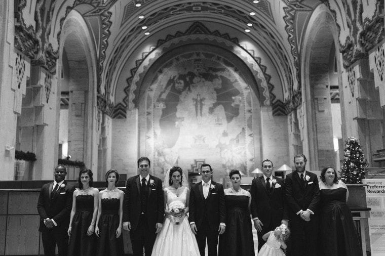 a wedding party poses for a photograph in the Guardian Building in Detroit