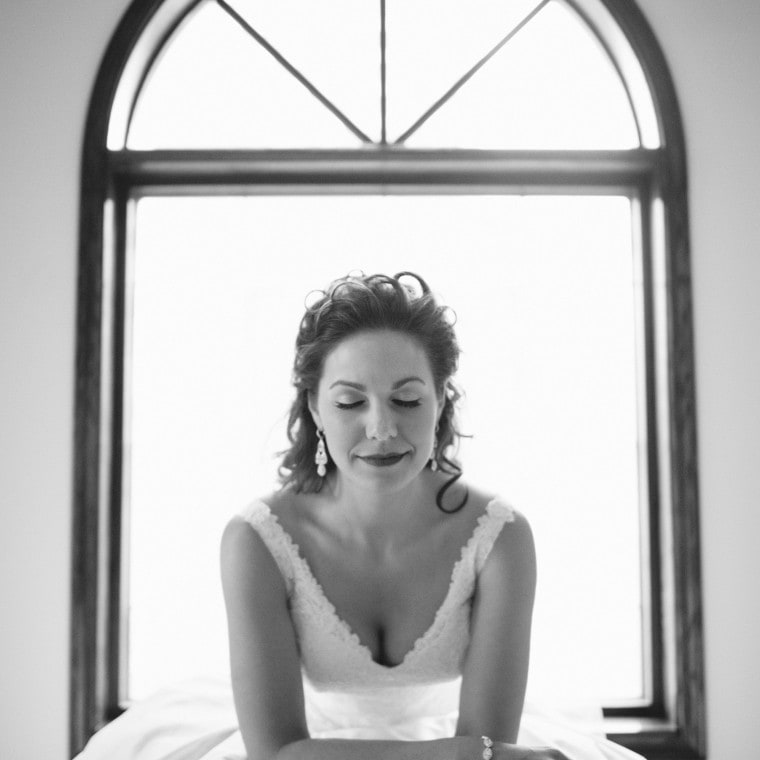 A black and white portrait of a bride in her wedding gown at Old St Mary's in Detroit