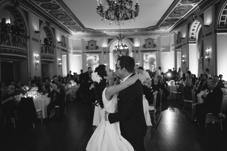 bride and groom share first dance at their Detroit Colony Club wedding by photographer Heather Jowett