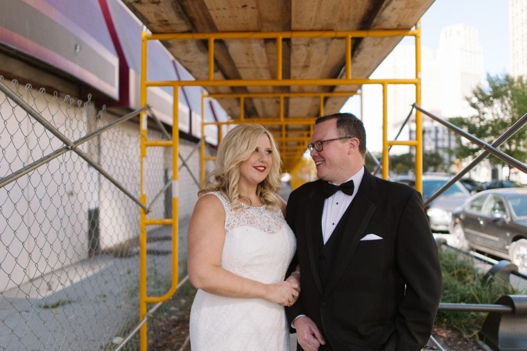 Bride and groom take portraits around downtown Detroit.