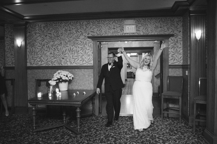 Bride and groom enter their wedding reception at the Gem Theater in Detroit