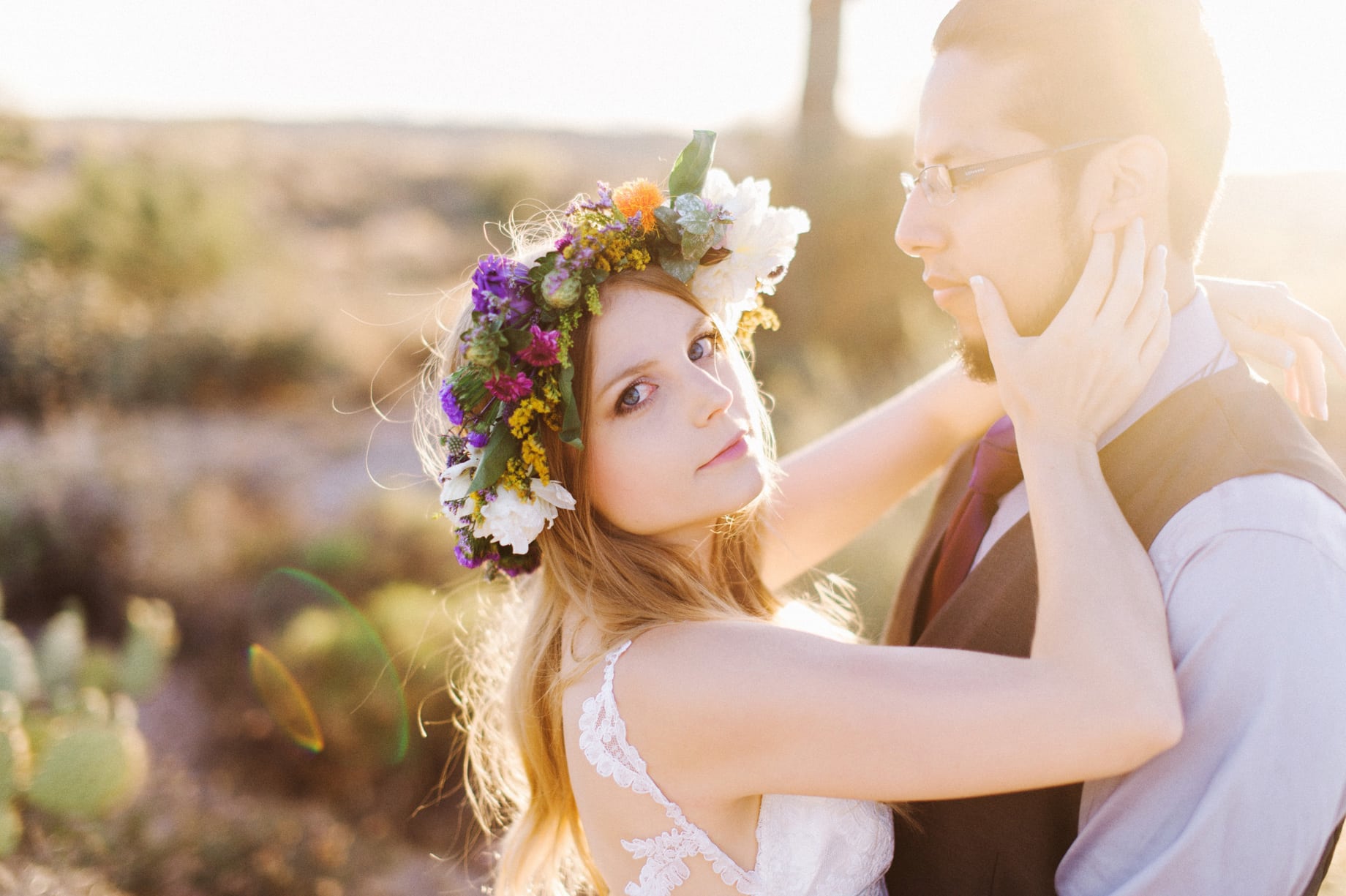 bride in colorful flower crown in desert