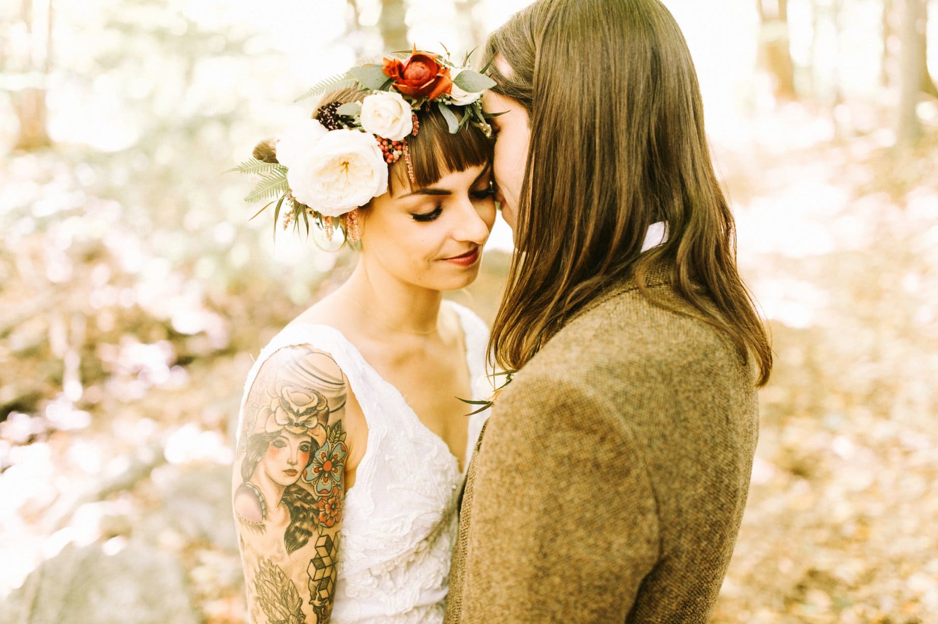 bride with tattoos and flower crown