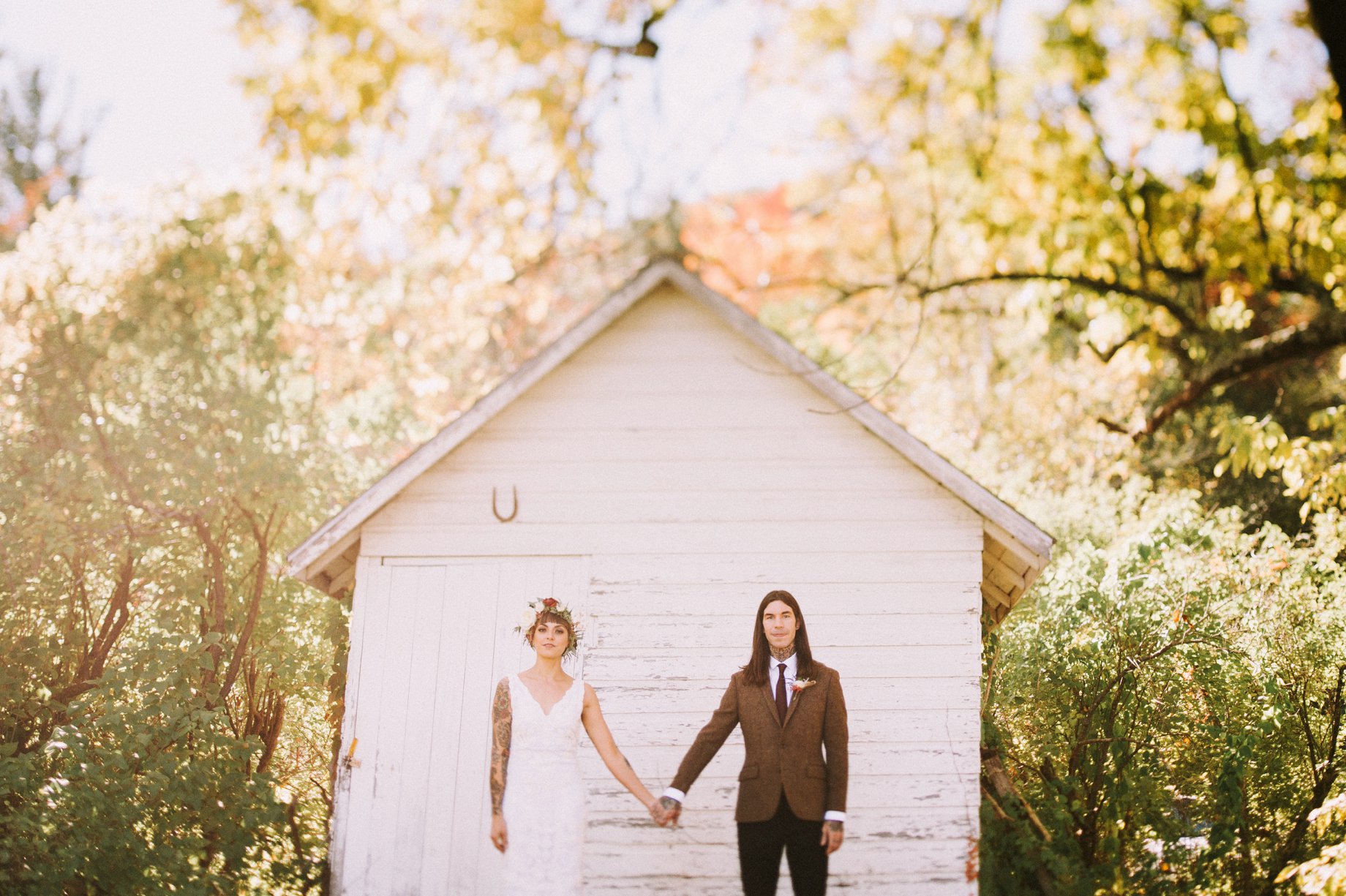 bride and groom holding hands