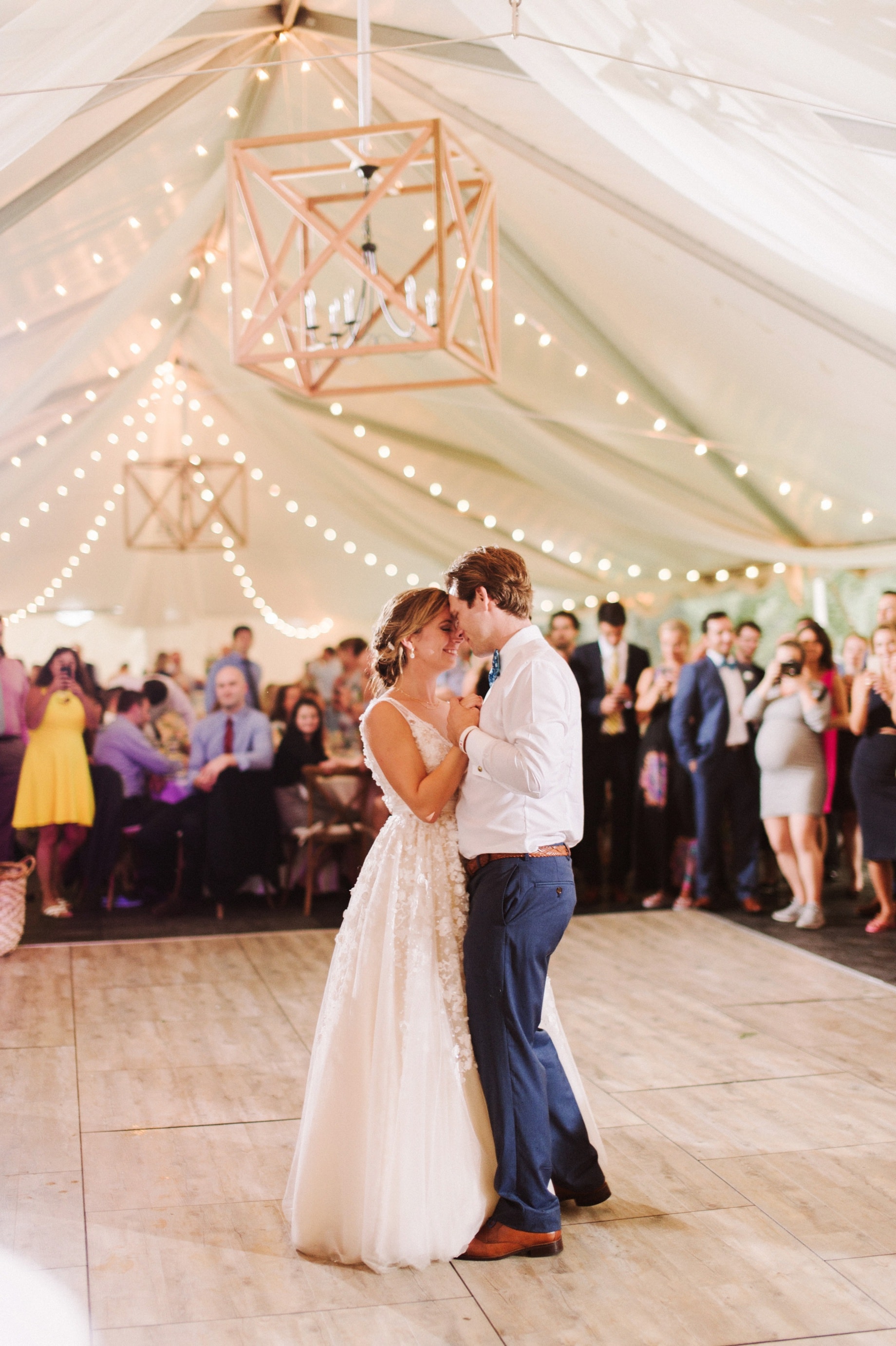 tented reception with chandeliers