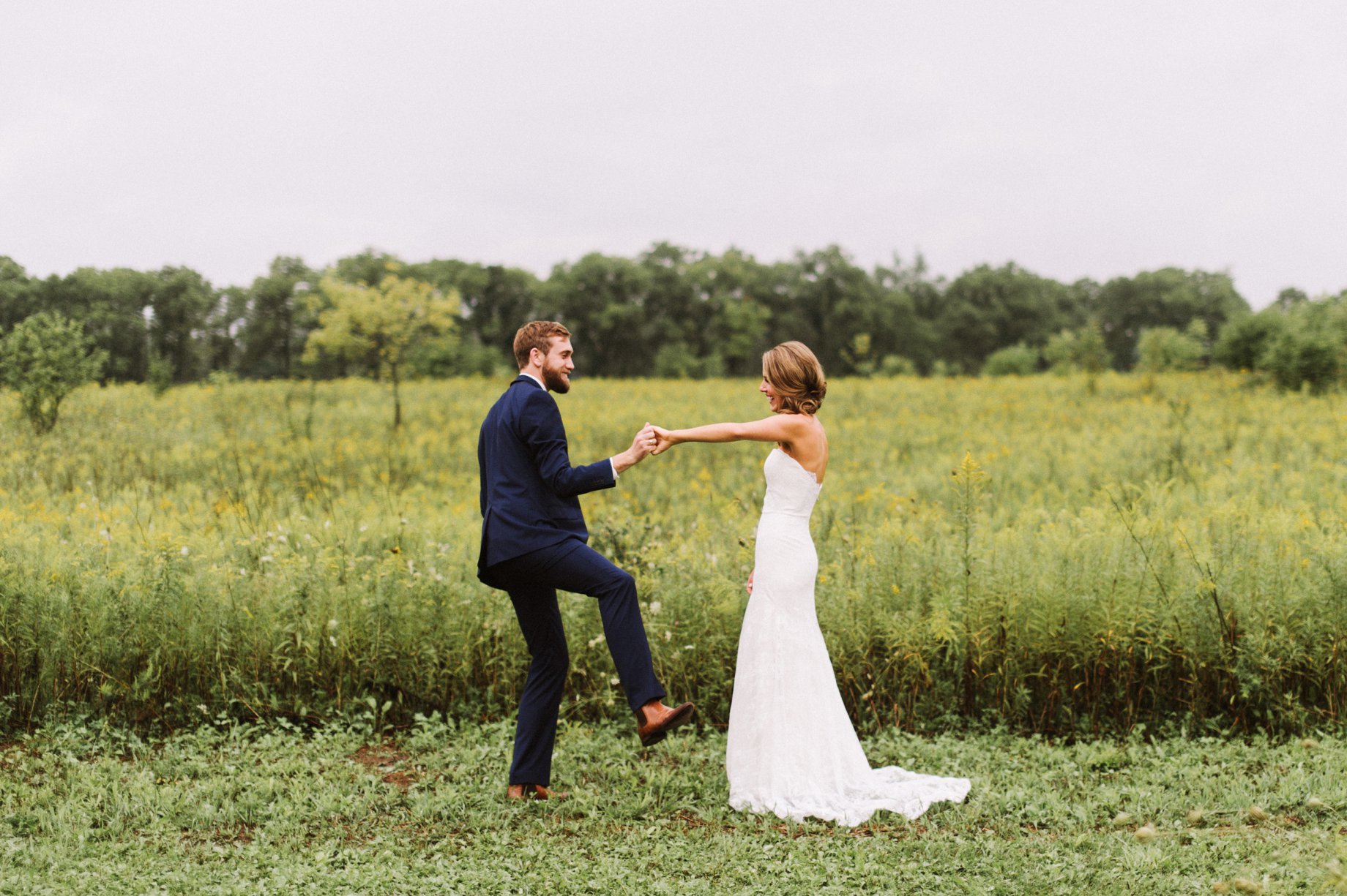 groom dancing with joy after first look