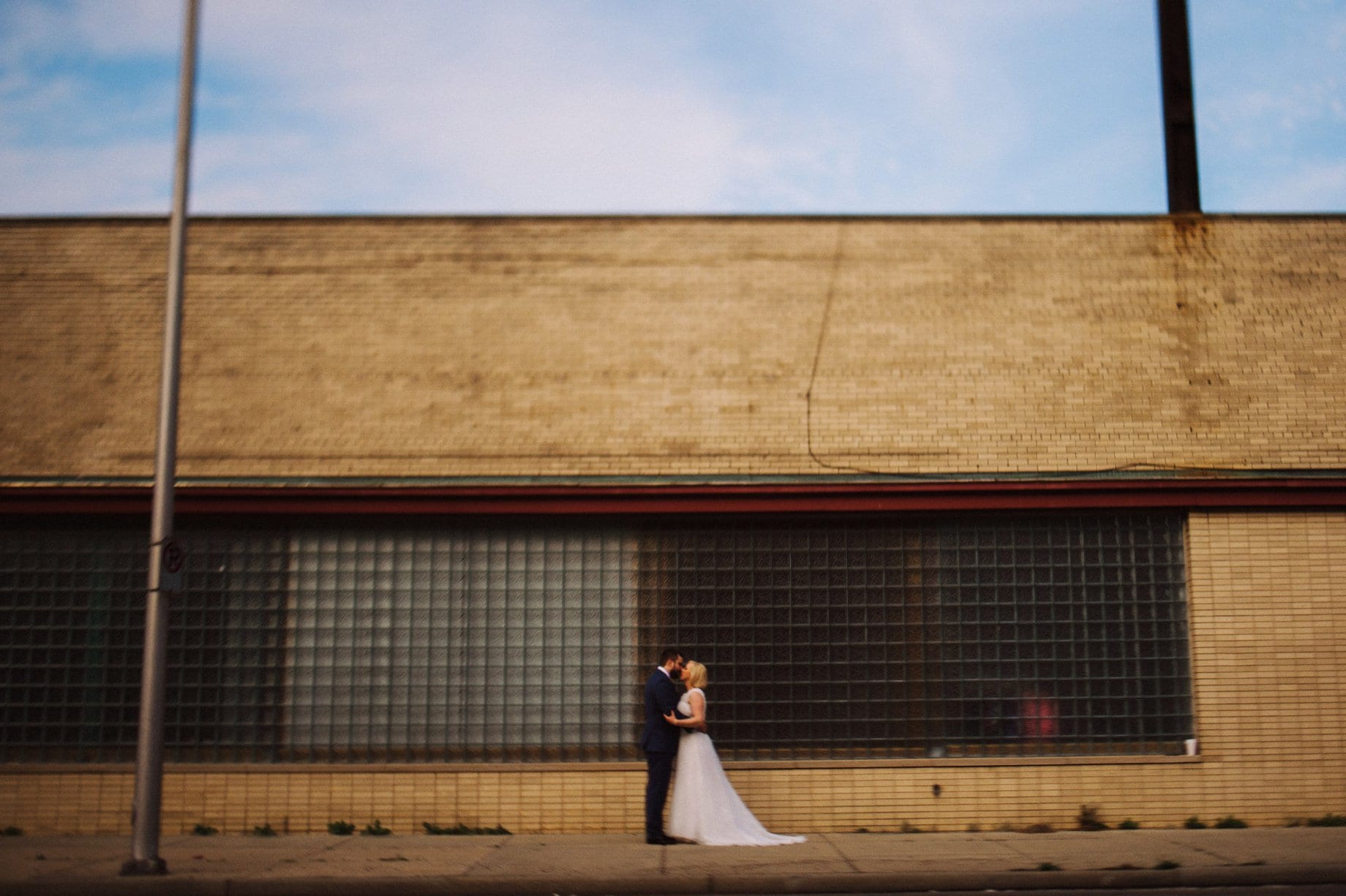 bride and groom pose for portrait in downtown pontiac