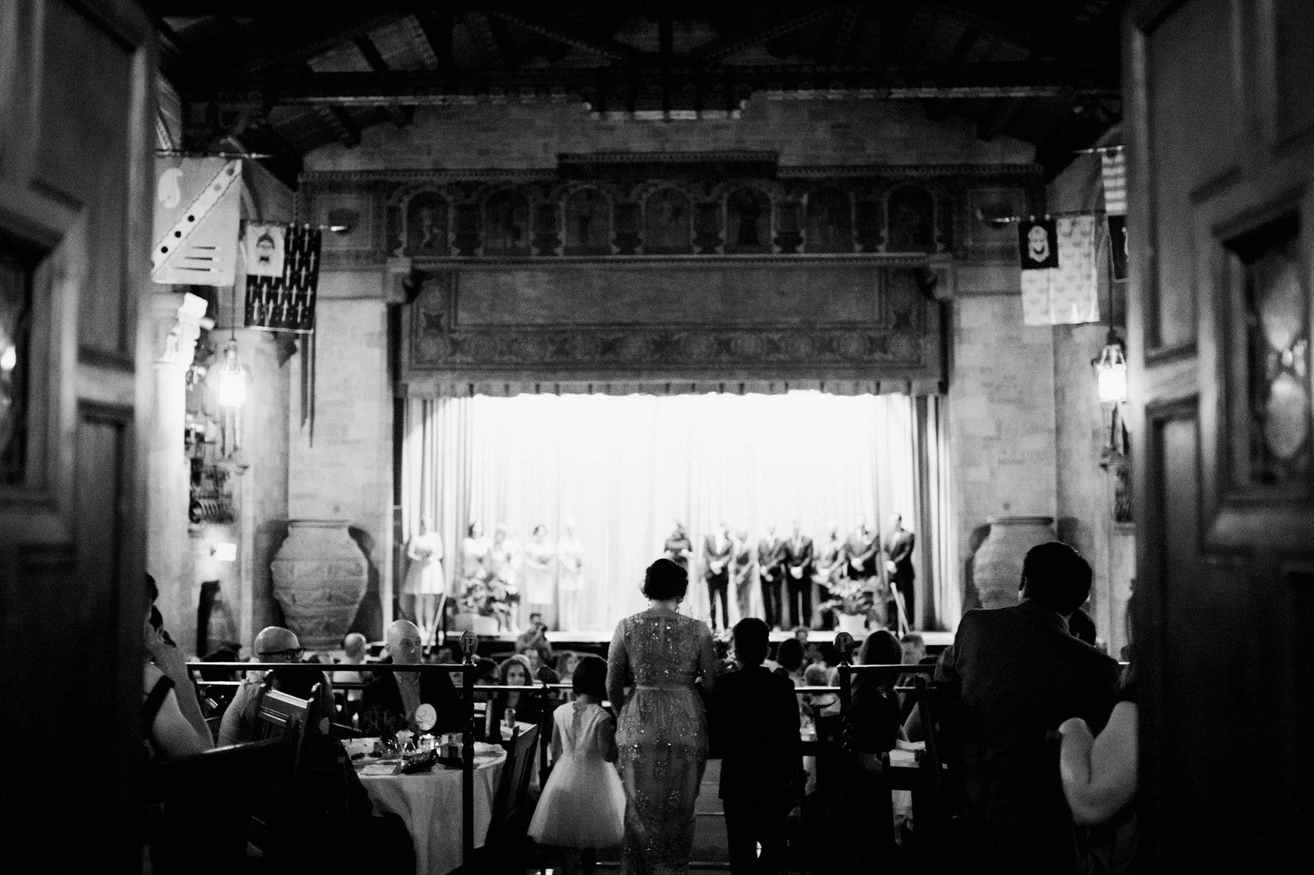 bride enters wedding ceremony with her children at the players playhouse in detroit