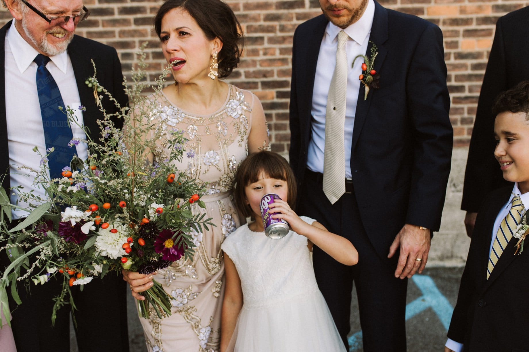 in true detroit fashion a flower girl drinks a faygo