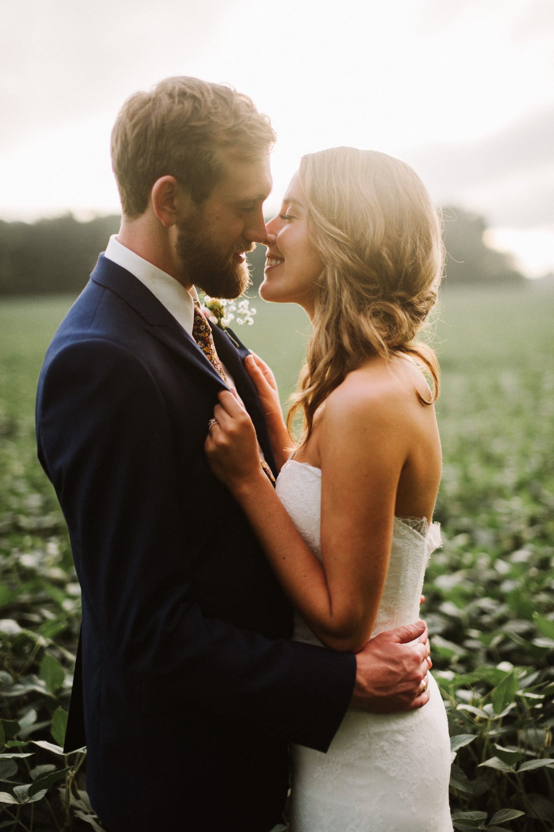 bride and groom in soybean field