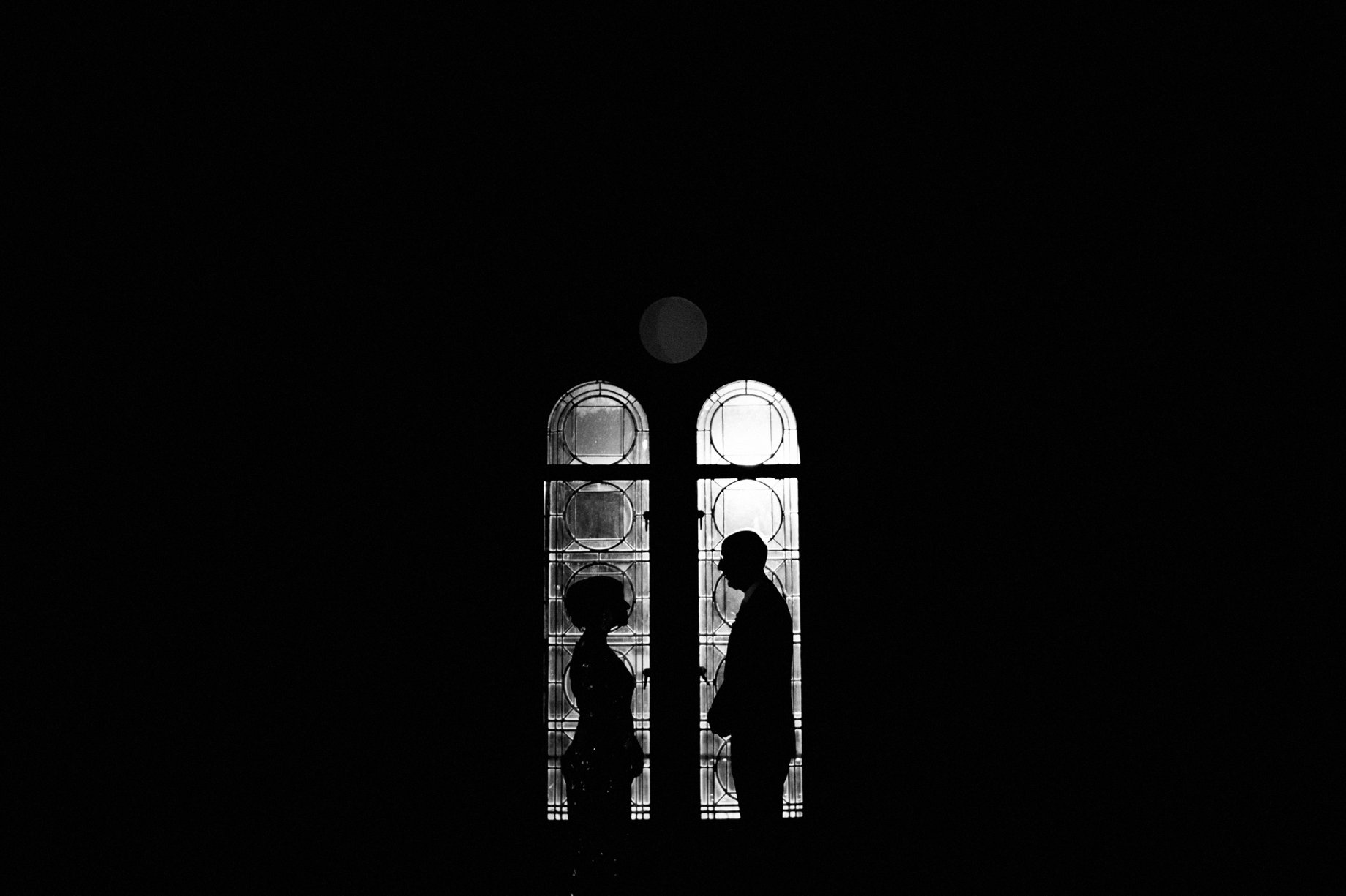 dramatic and artistic nightime portrait of bride and groom