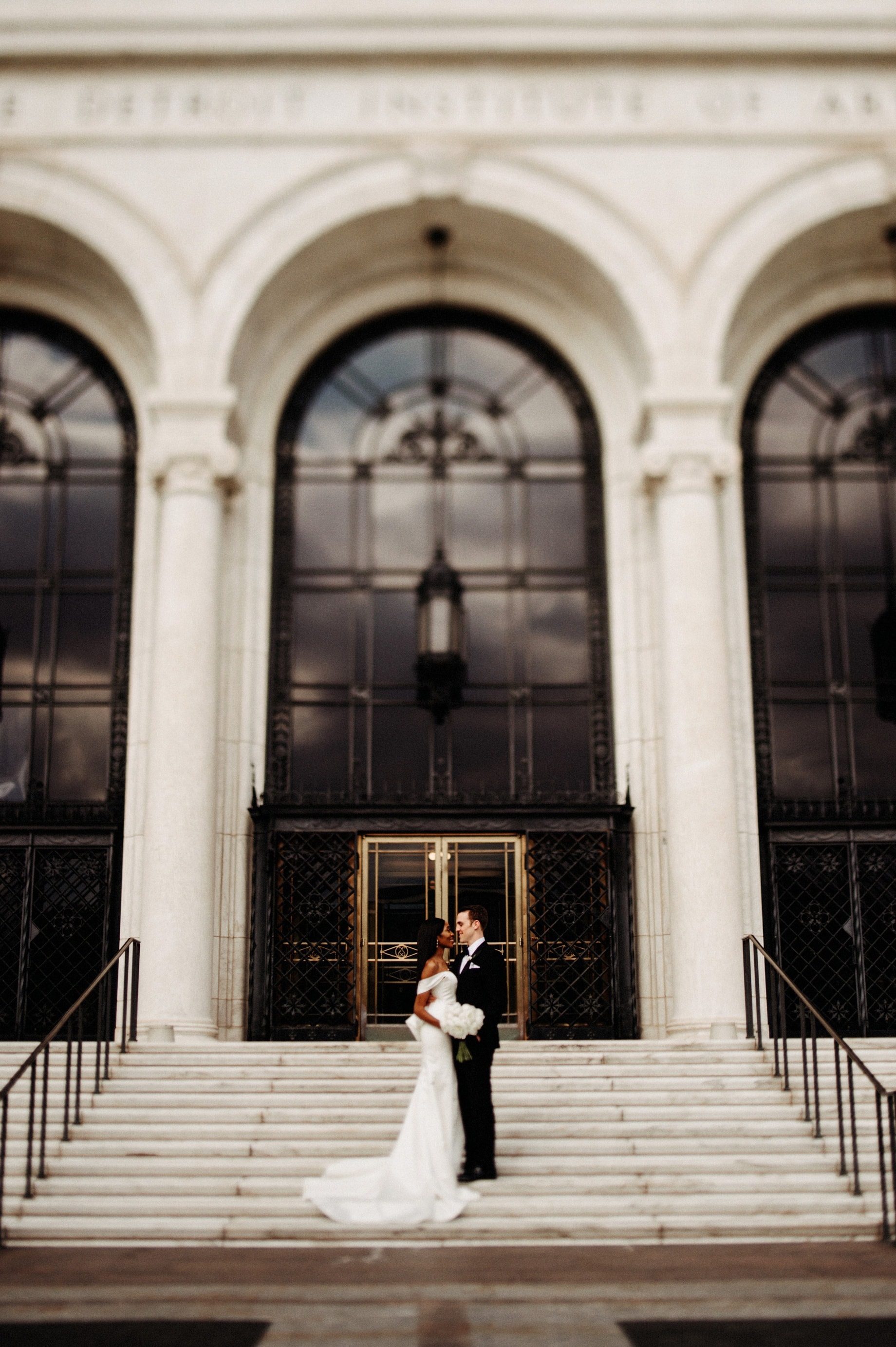 bride and groom outside of their Detroit Institute of Arts wedding