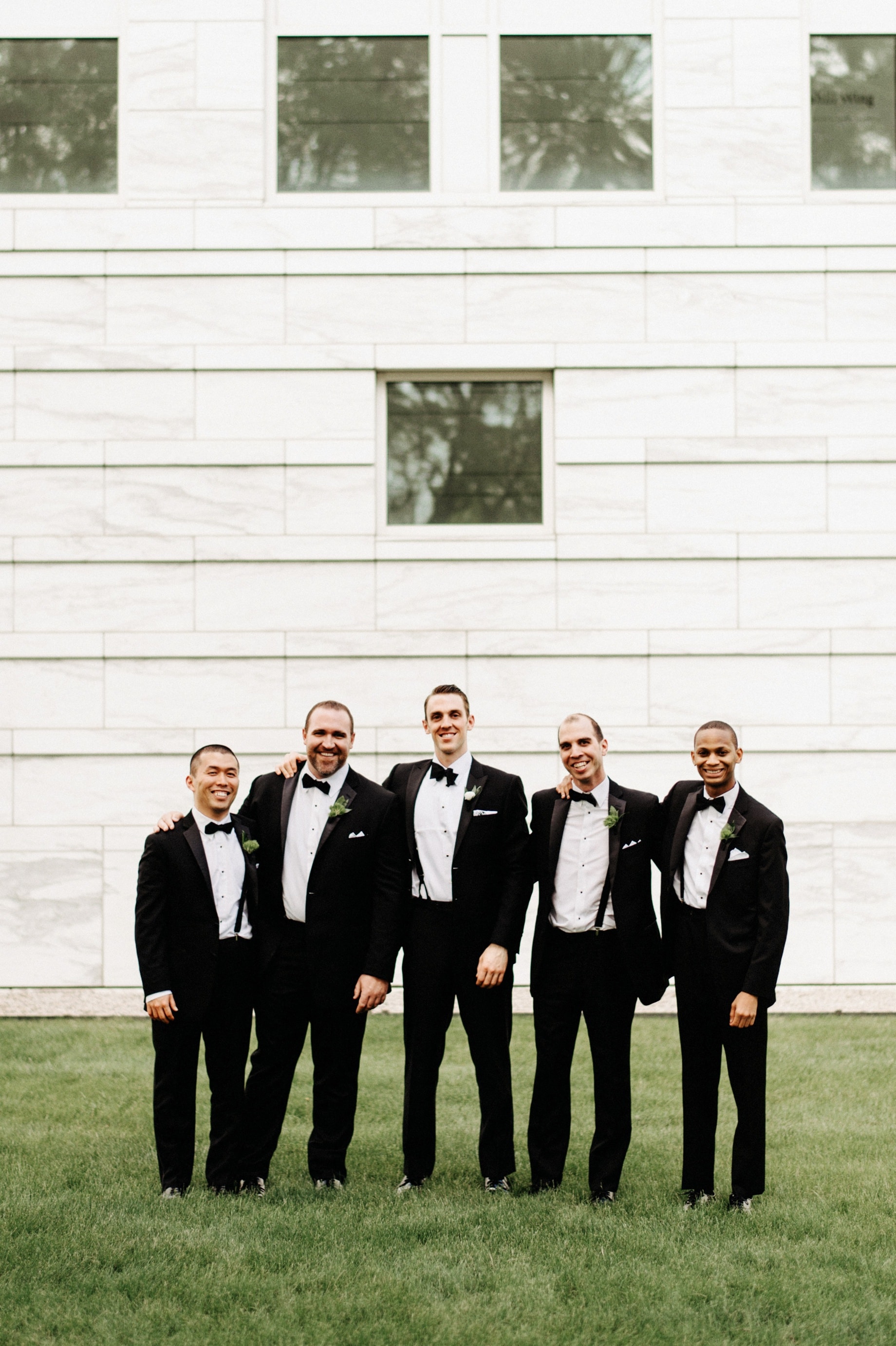 groomsmen in tuxedos