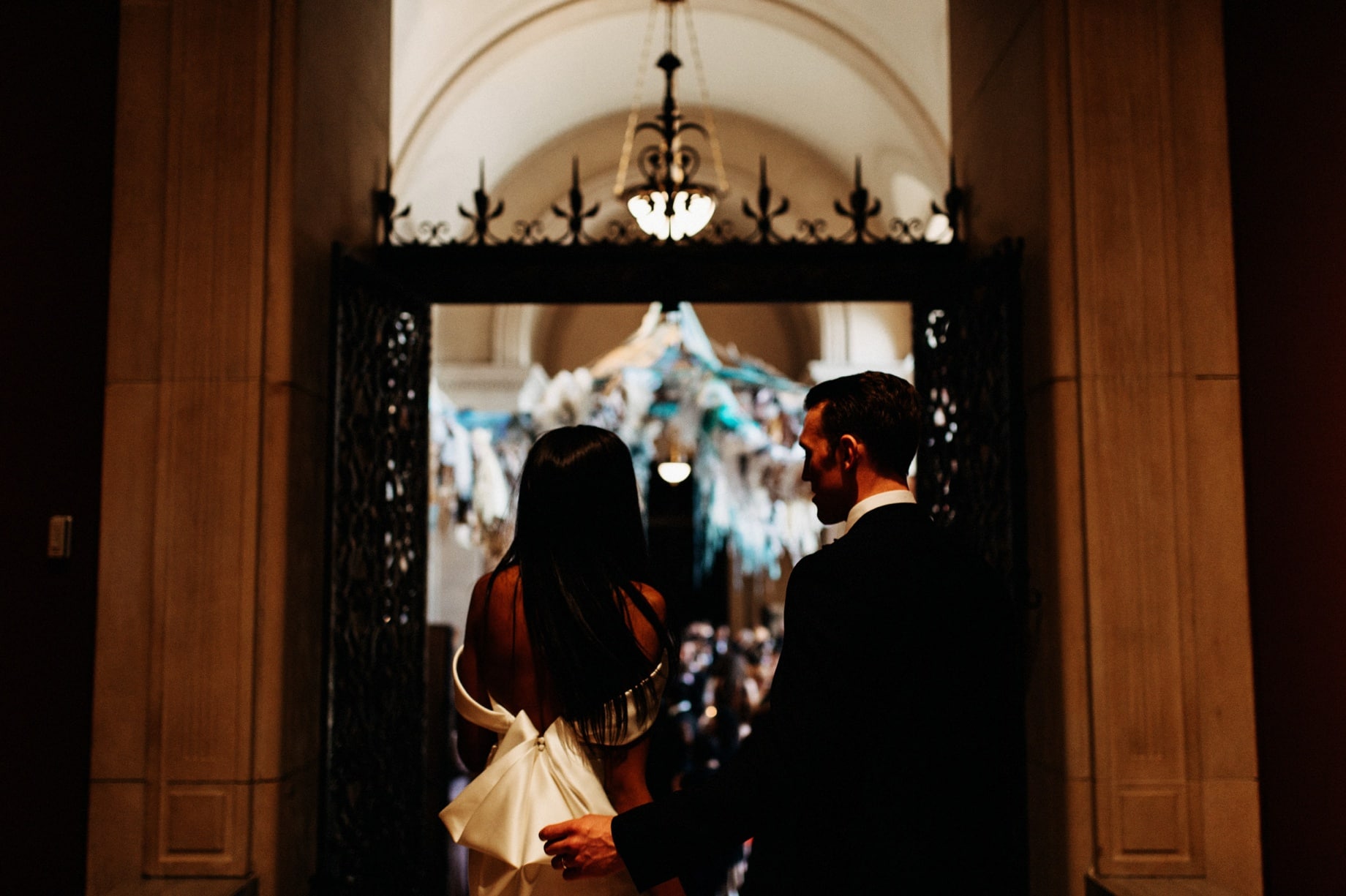 bride and groom entering their reception