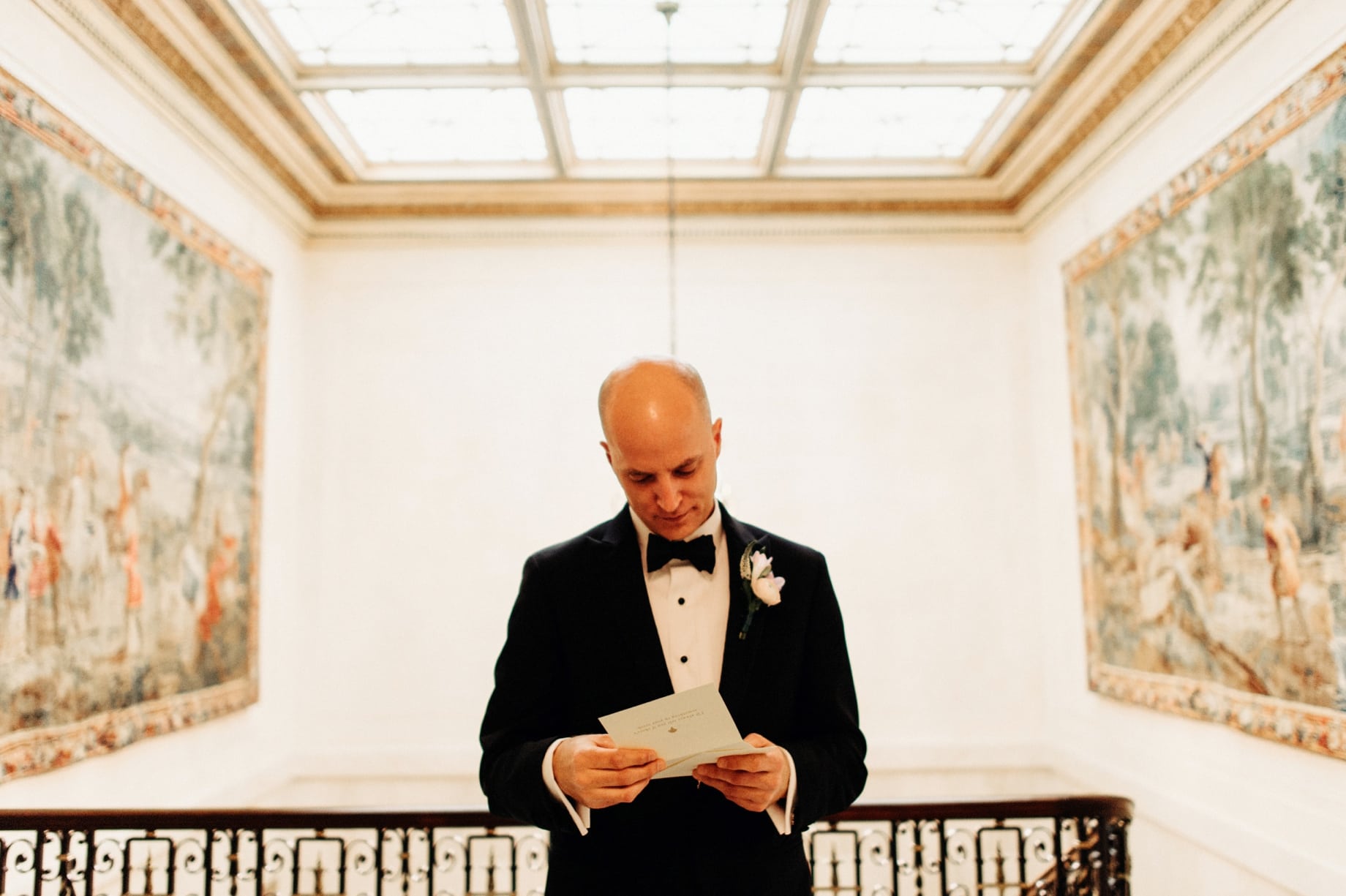 groom reading letter from his bride