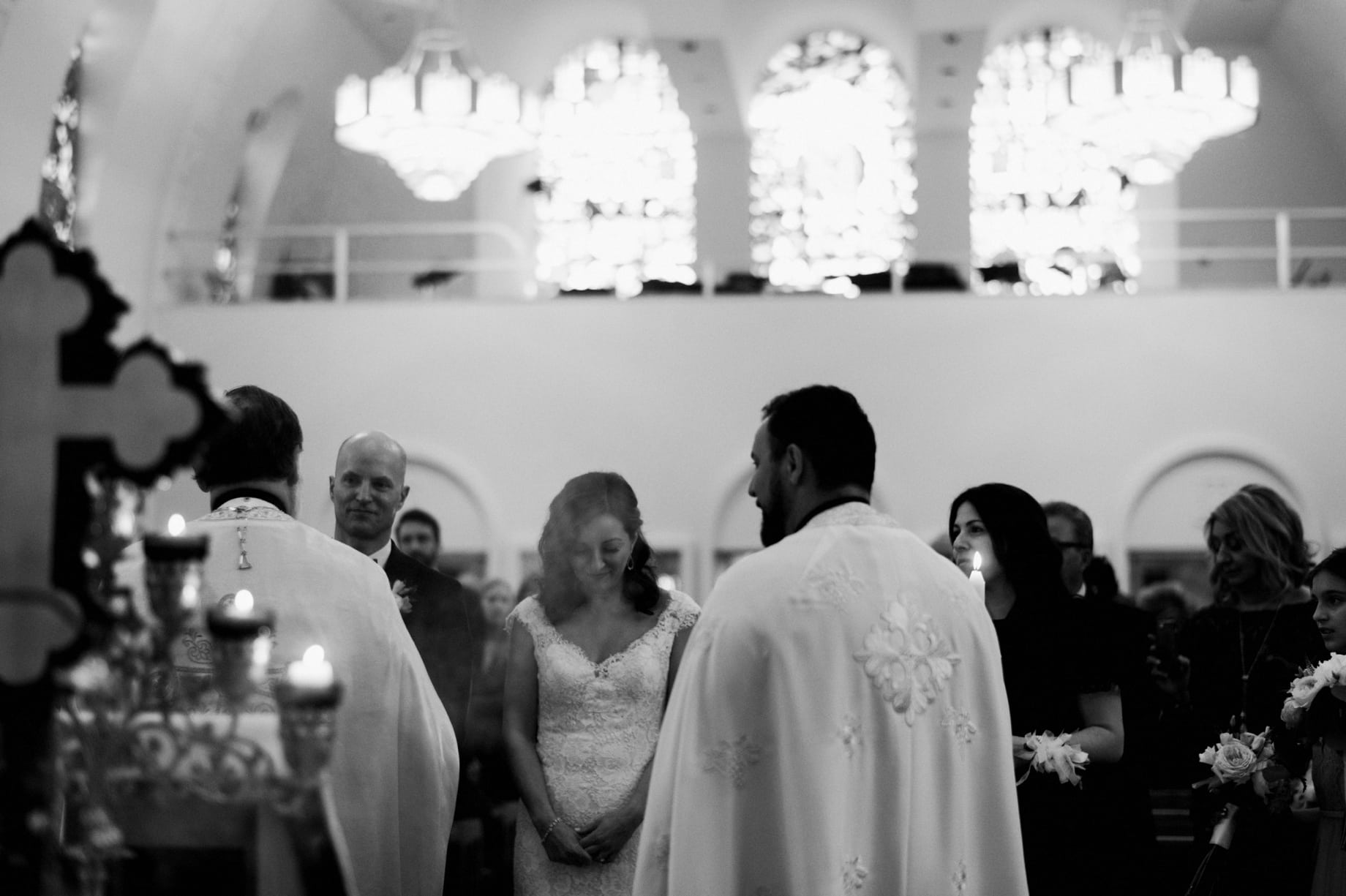black and white photo of bride and groom during wedding ceremony