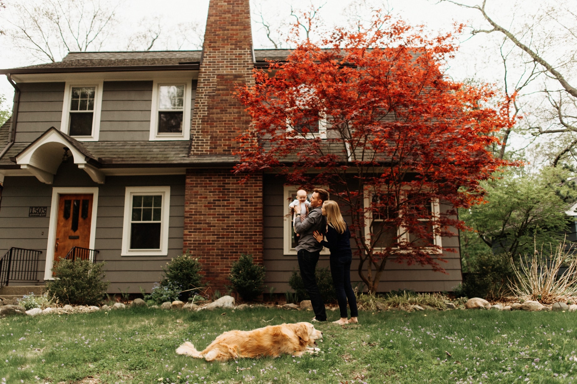 family in front of their ann arbor house