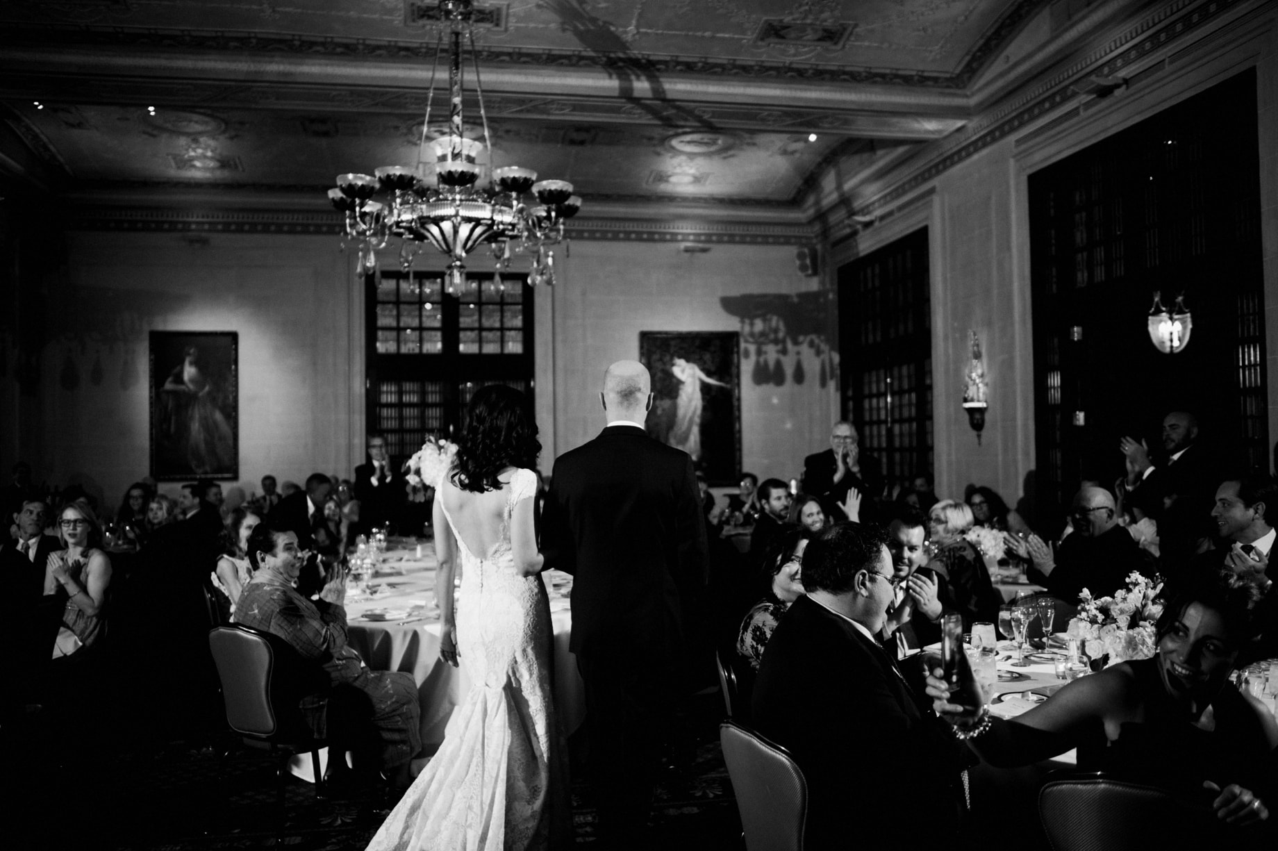 bride and groom entering their reception