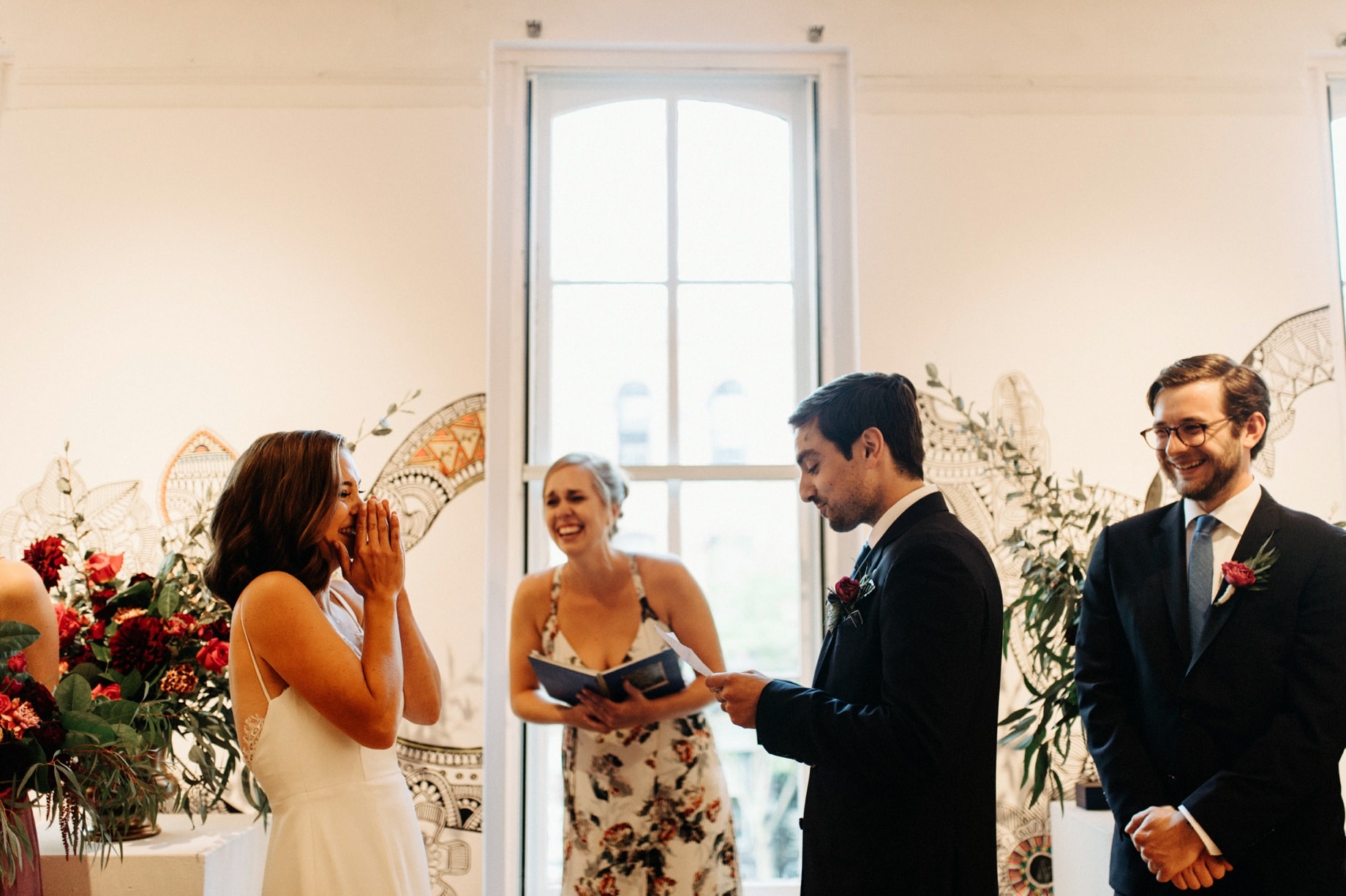 bride laughing during ceremony