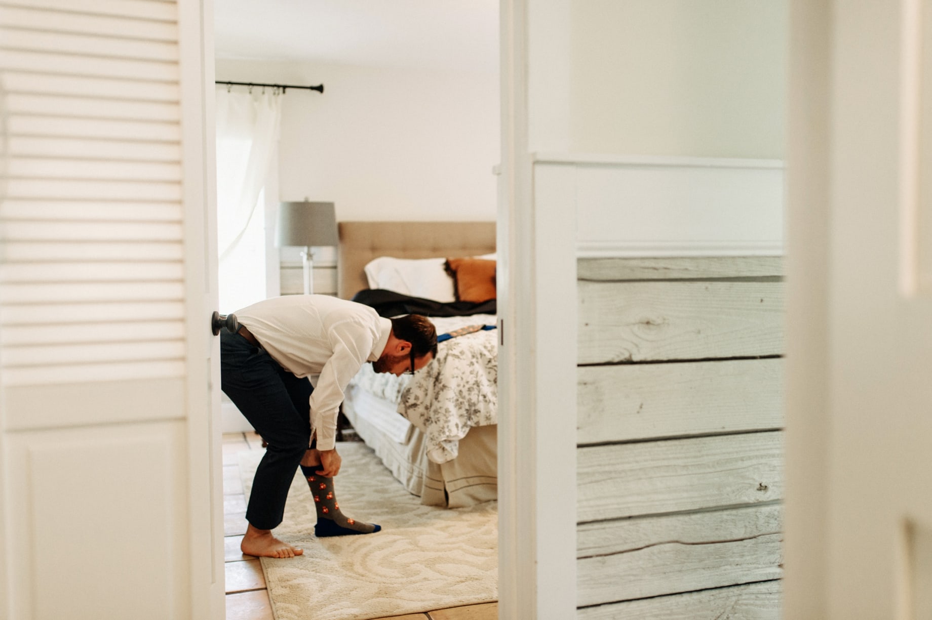 groom getting ready at orachard house bed and breakfast