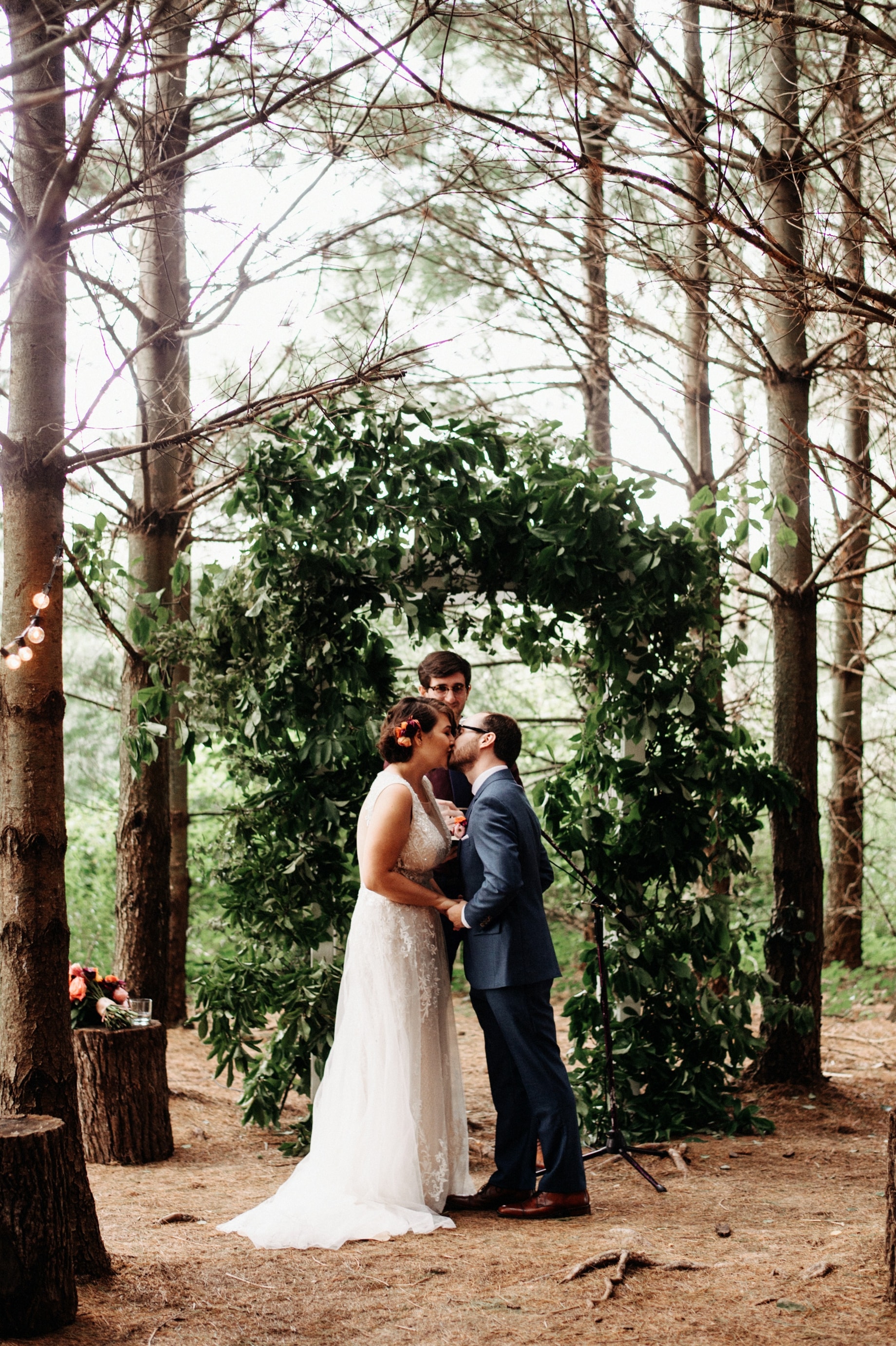 bride and groom share first kiss