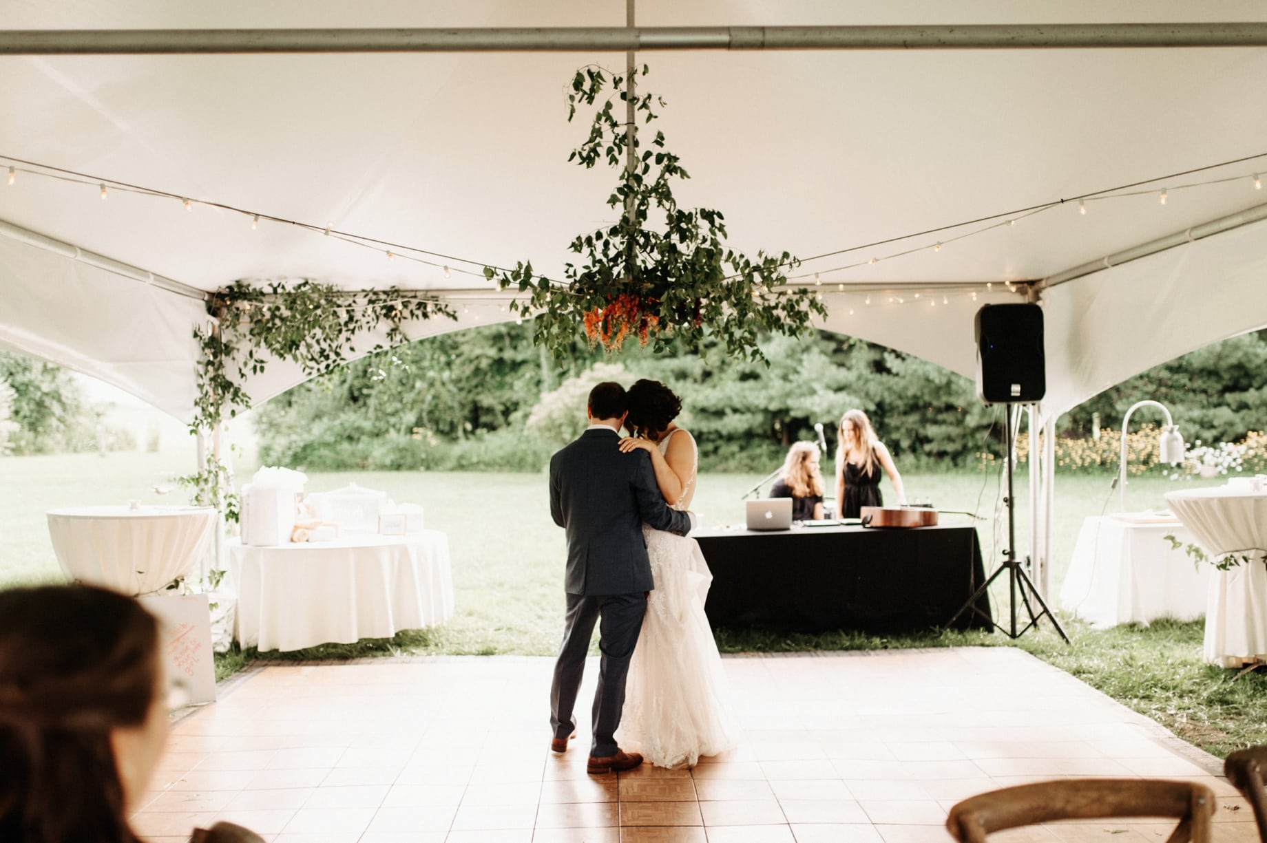 first dance under floral chandelier