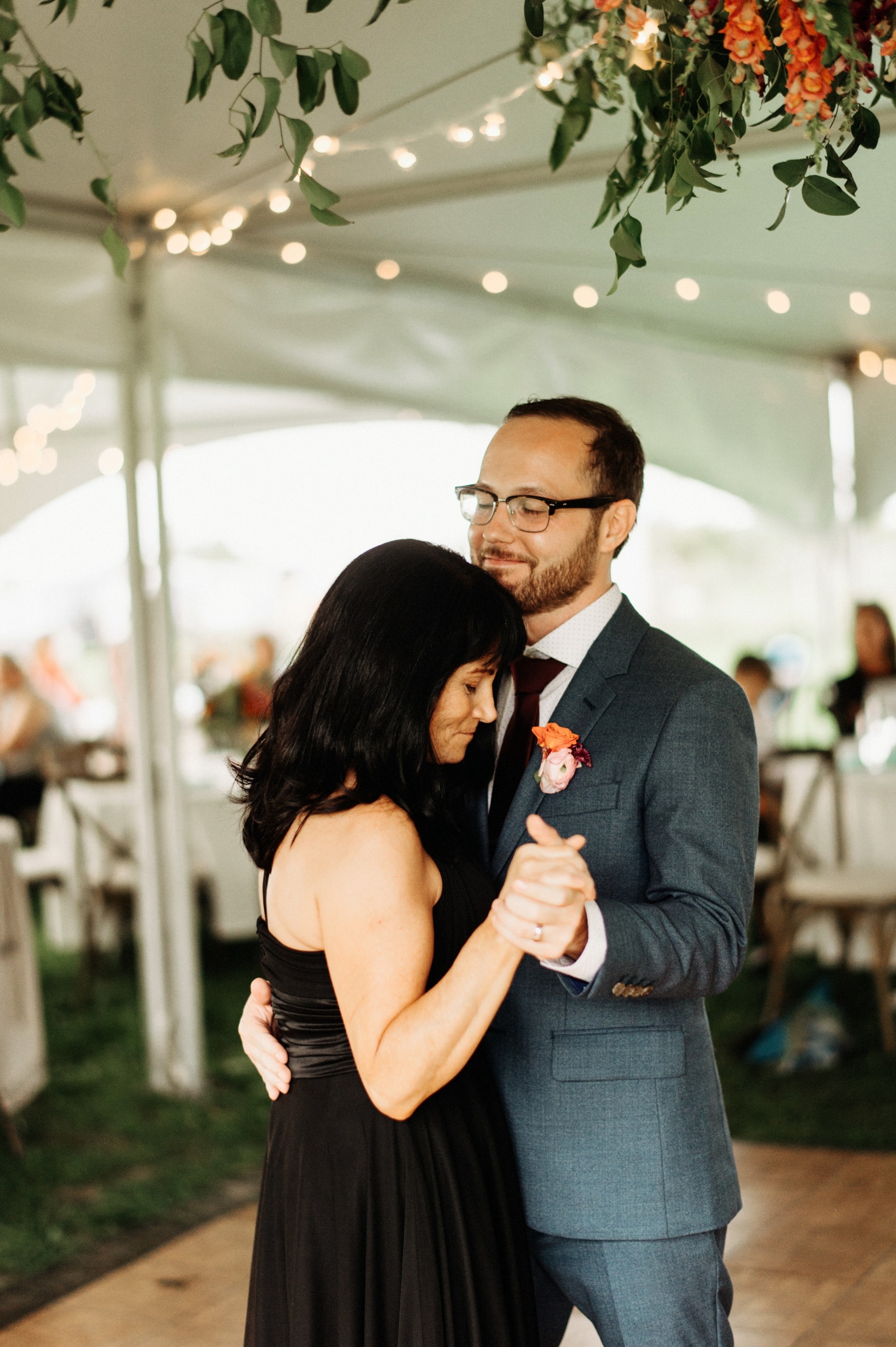 mother of the groom dancing with son