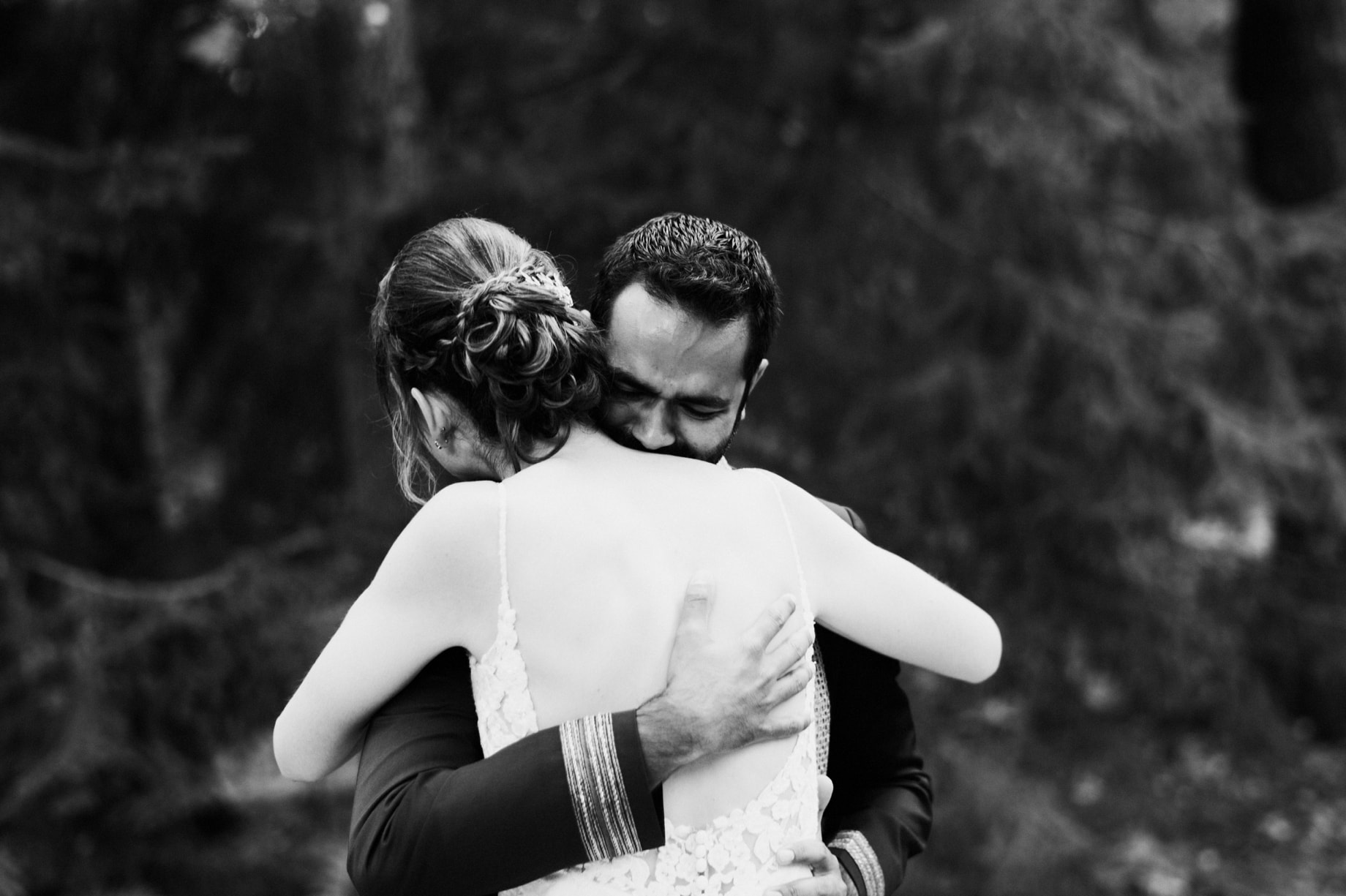 groom hugs bride