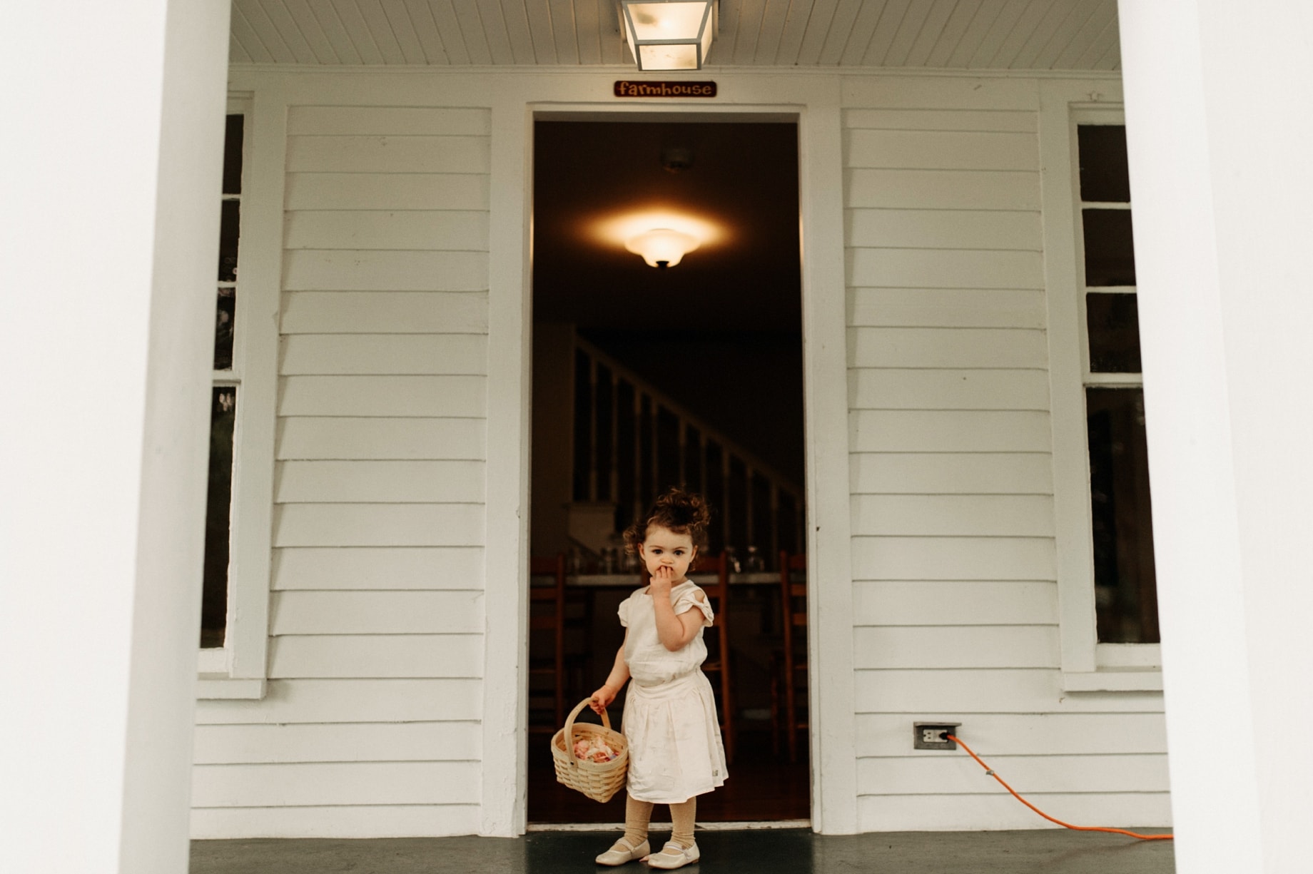 shy flower girl hesitating coming down the aisle