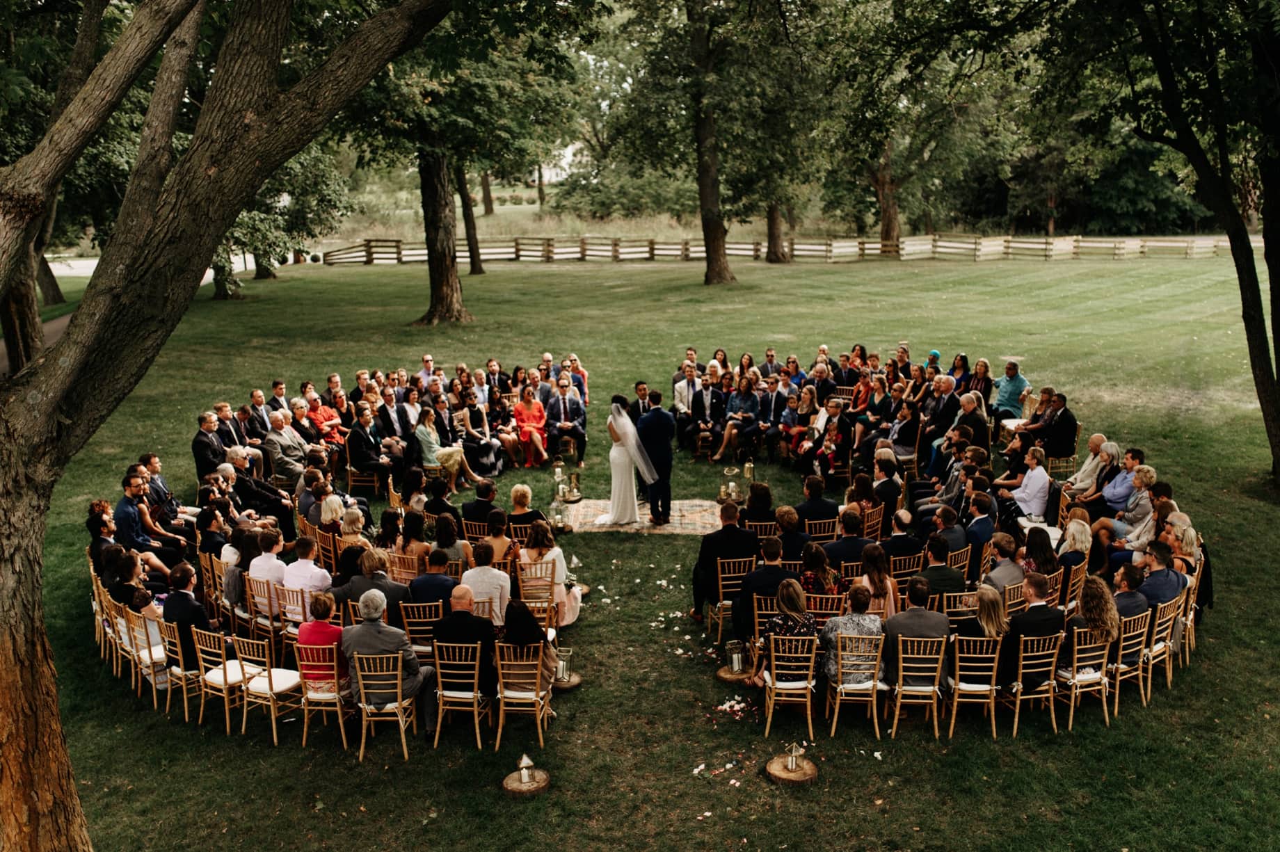 bohemian wedding ceremony on the front lawn of cornman farms