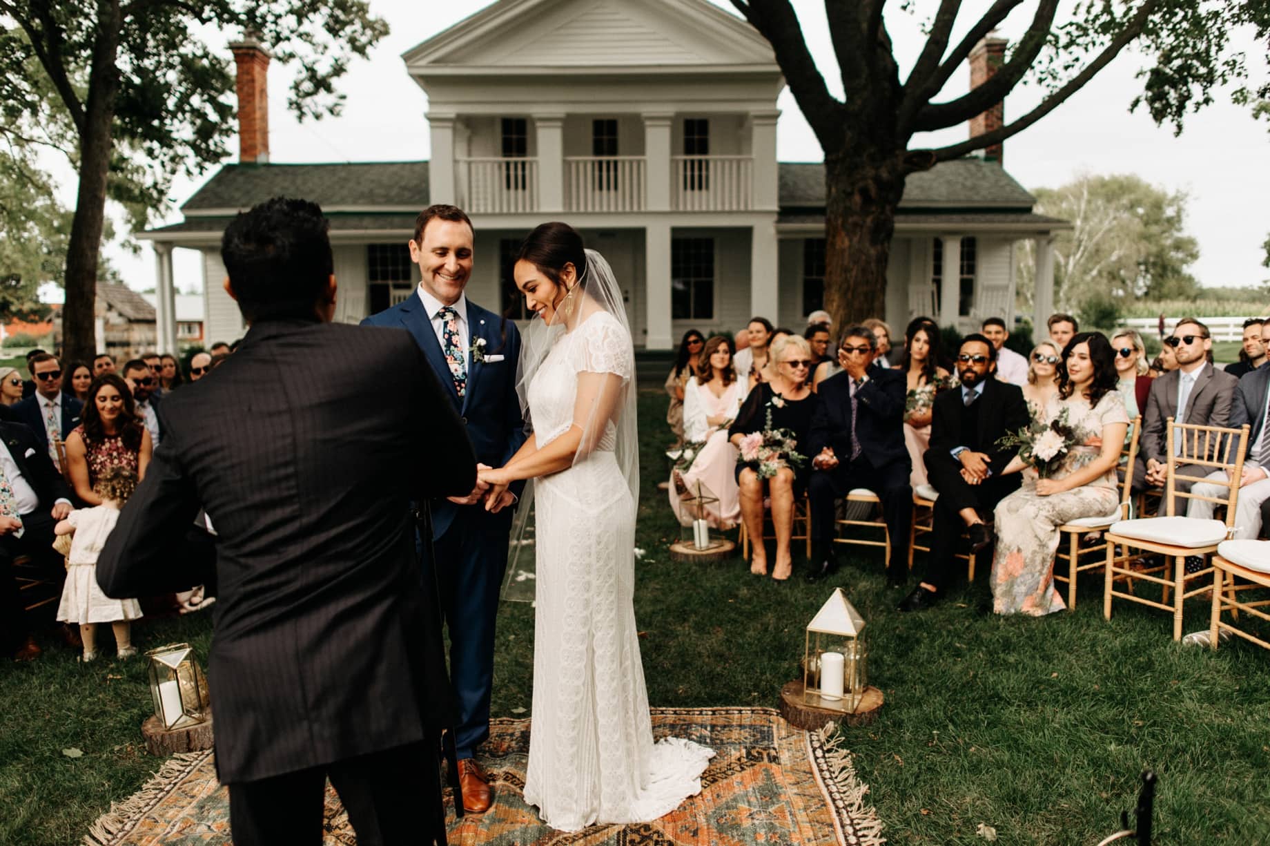 bride and groom share a laugh during their wedding ceremony