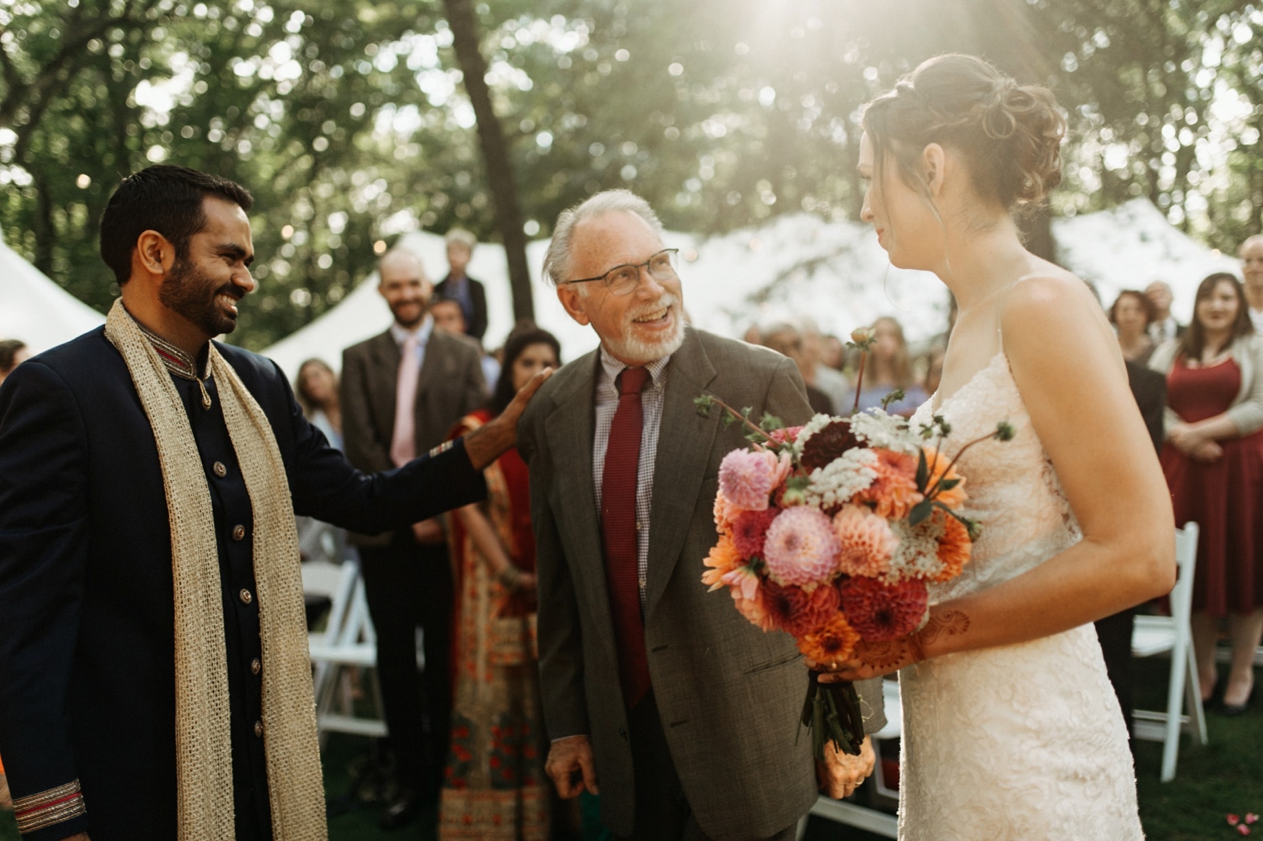 father of the bride giving away his daughter