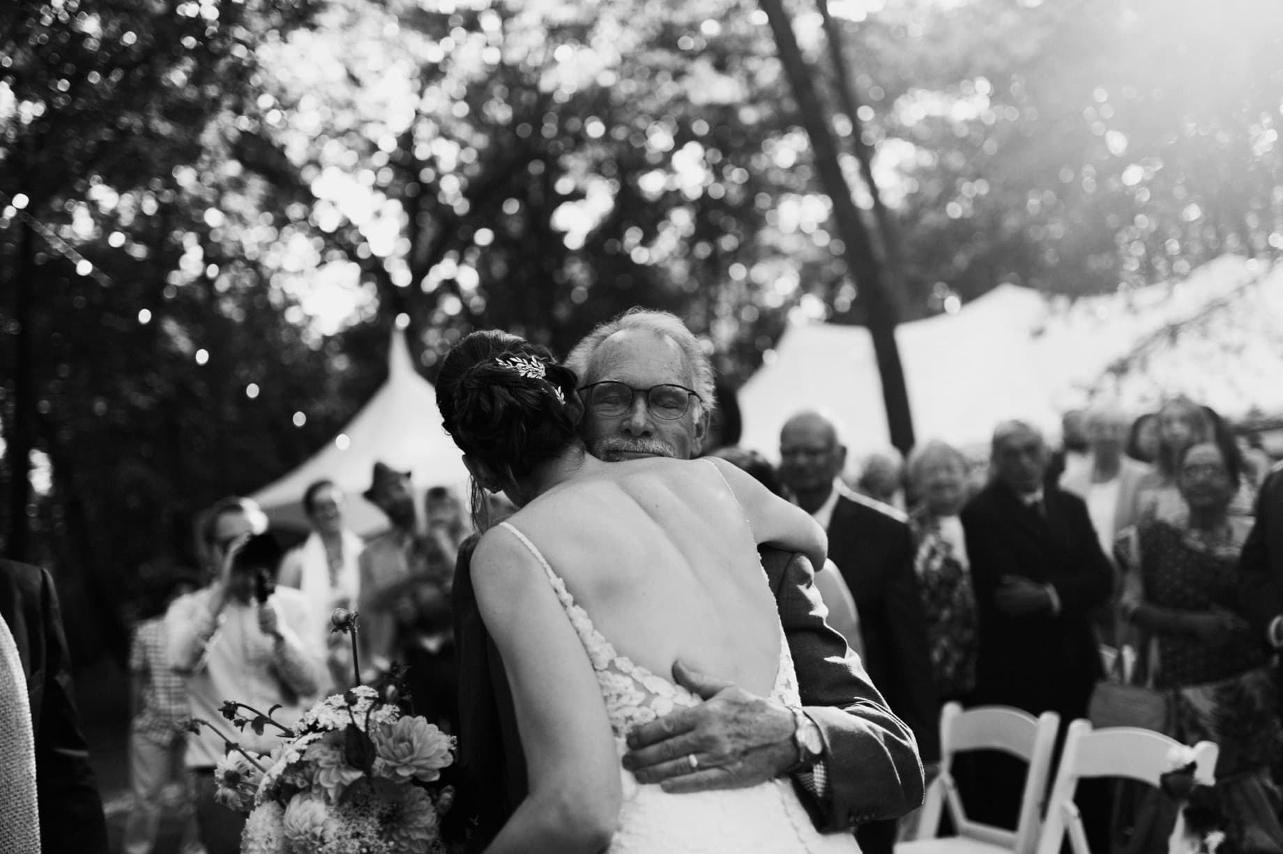 father giving his daughter a hug on her wedding day