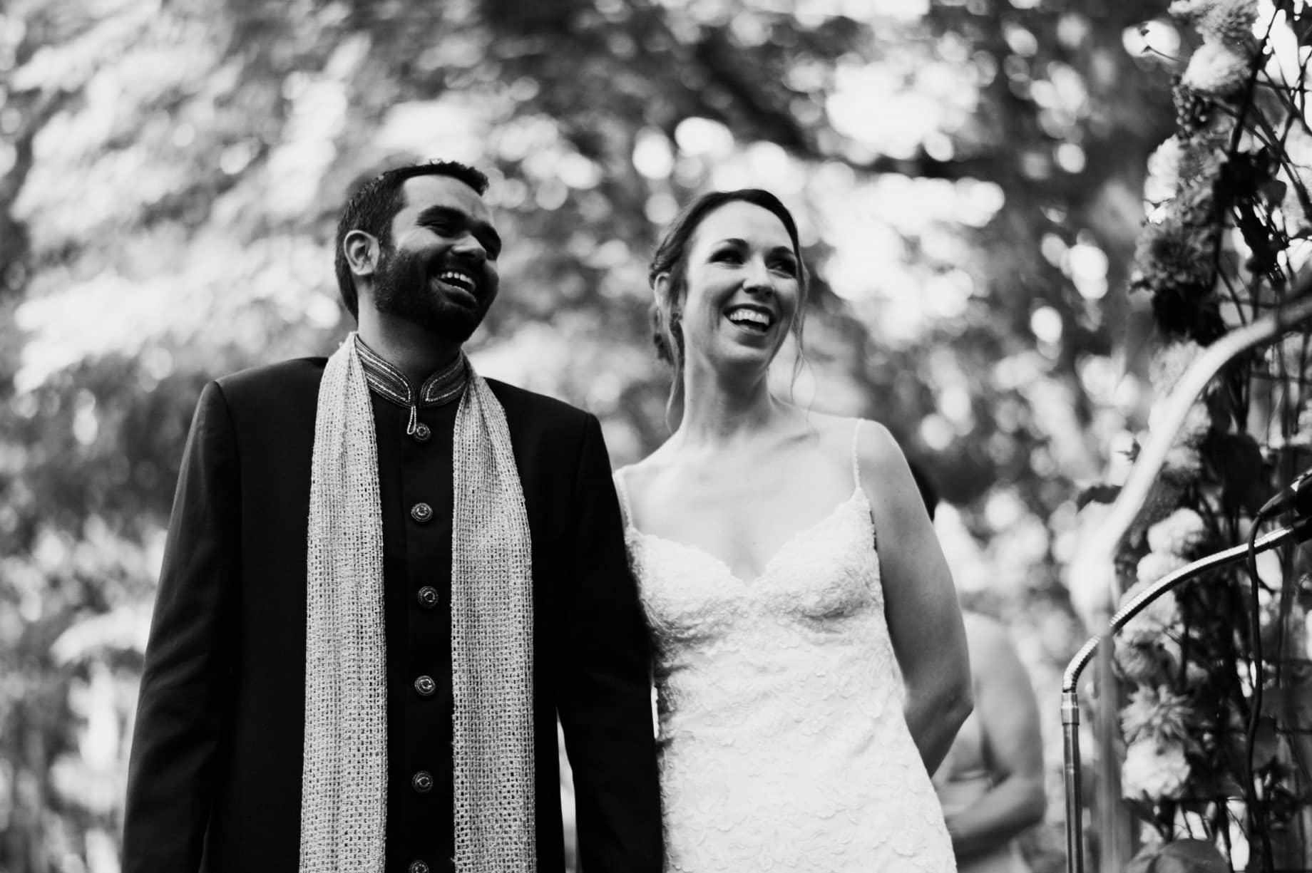 bride and groom laughing during ceremony