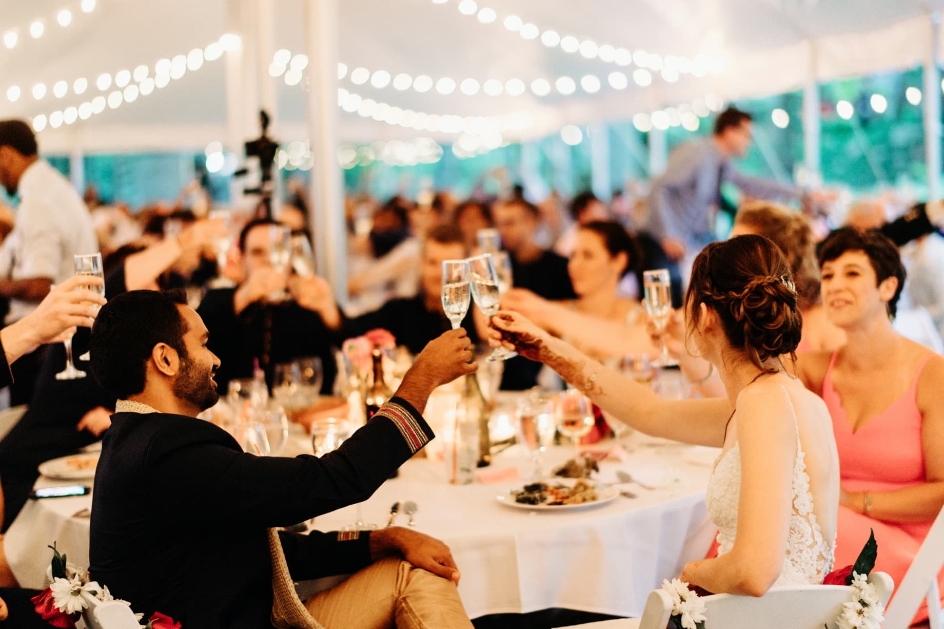 bride and groom cheersing their glasses