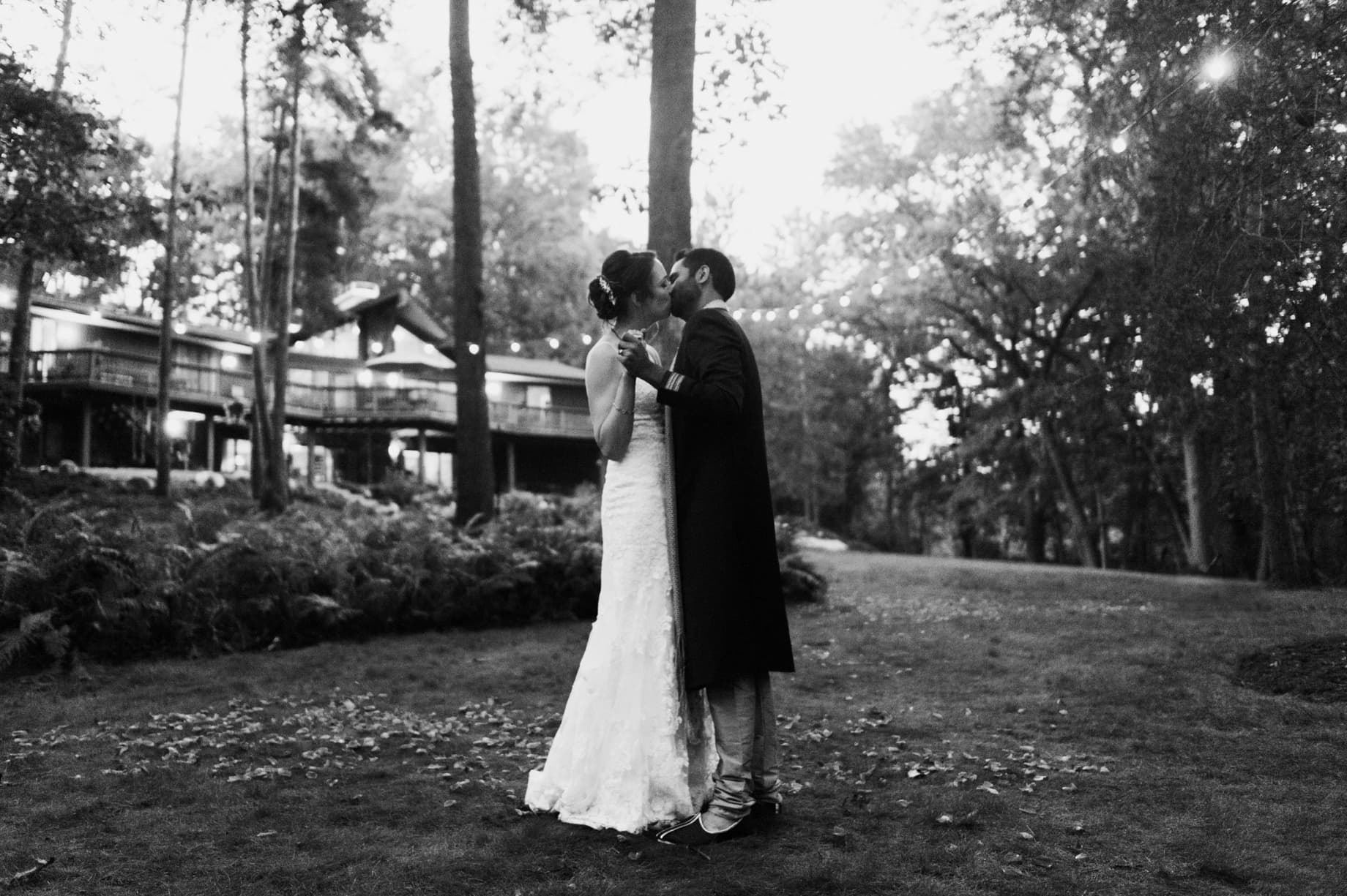 bride and groom share a kiss after their first dance