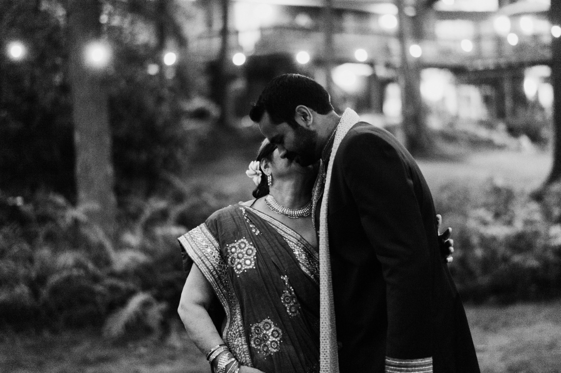 mother of the groom sharing a sweet moment with her son