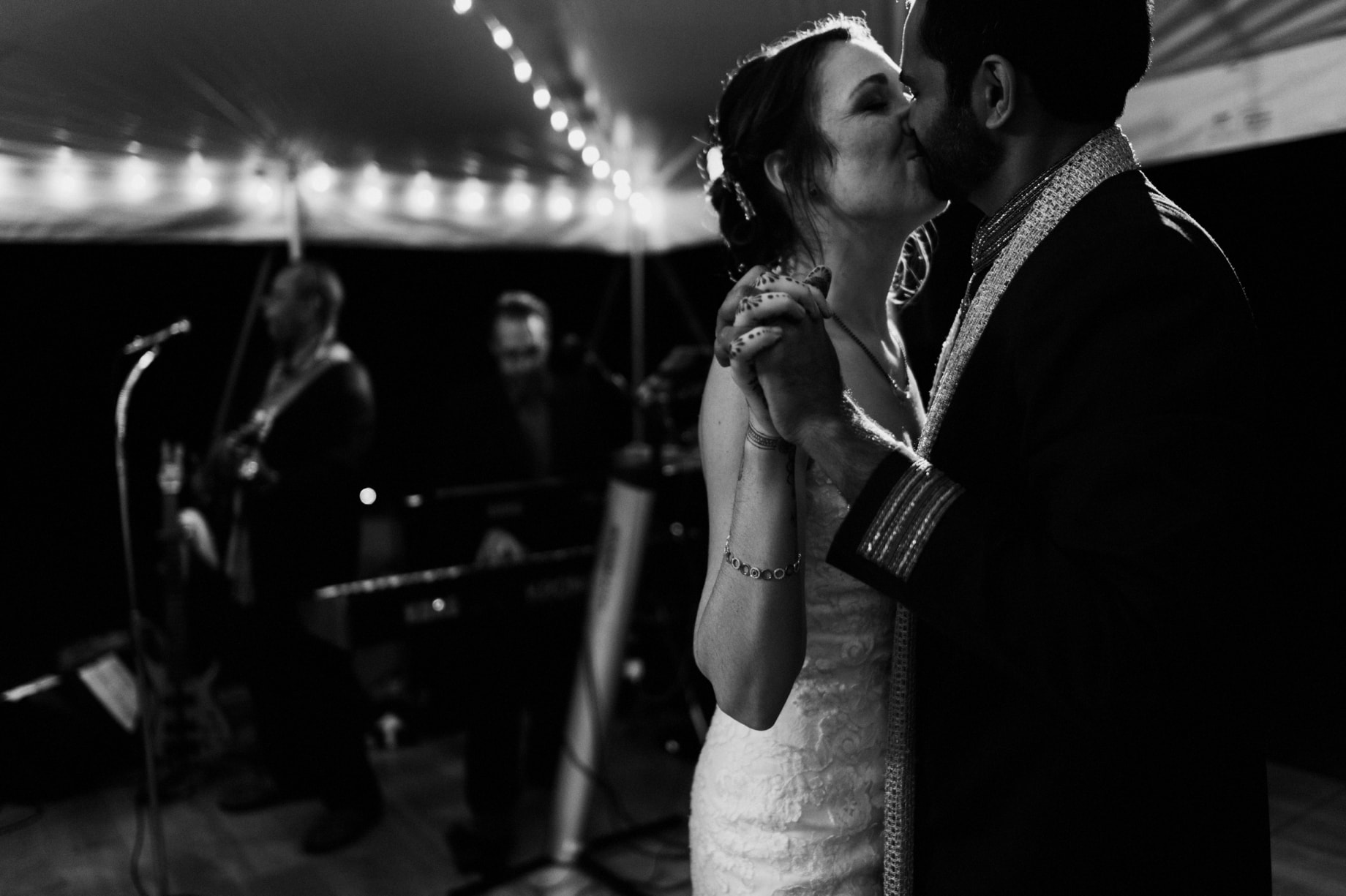 bride and groom share a kiss during their backyard wedding in bloomfield hills
