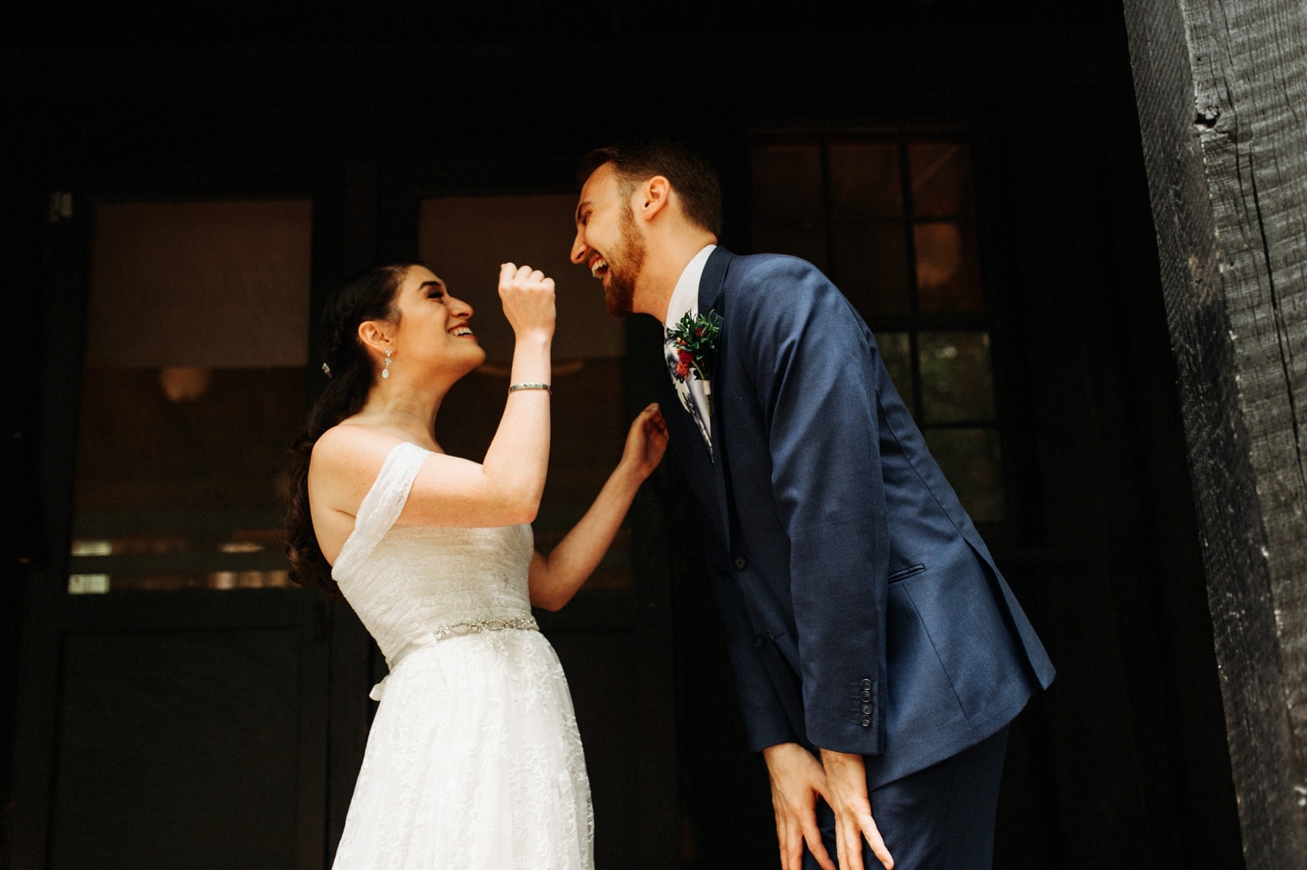 bride and groom share a happy moment after their first look