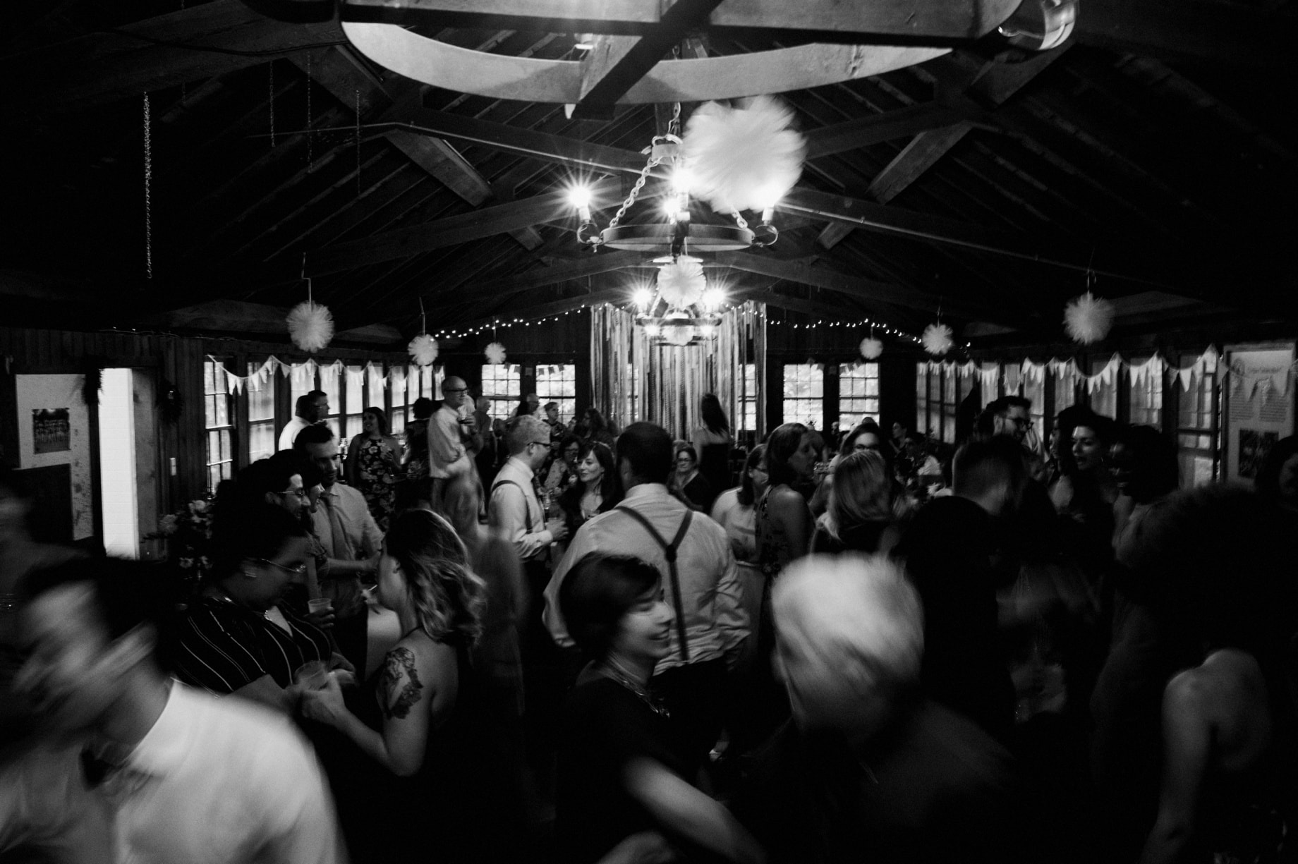 wedding guests dancing at a wooded wedding