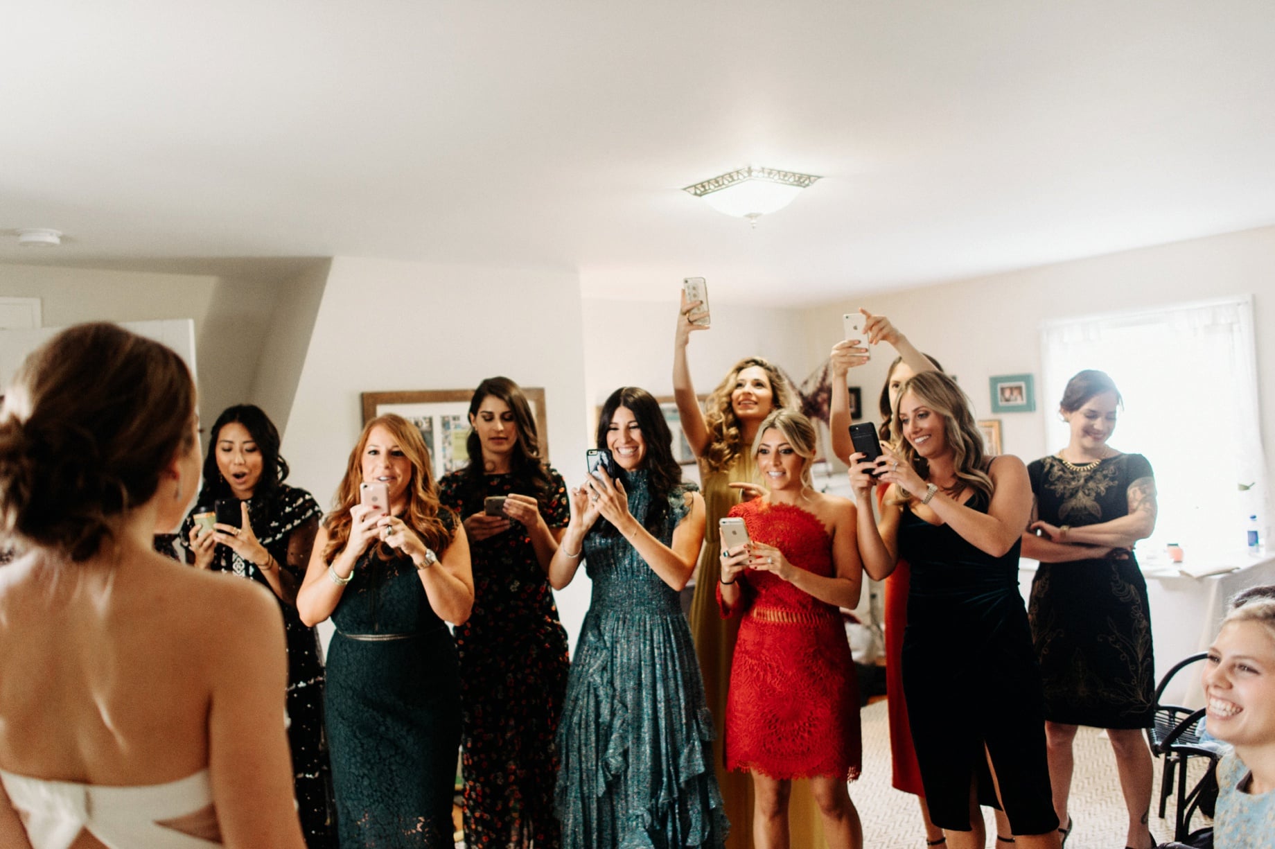 bridesmaids react to seeing bride in her dress for the first time