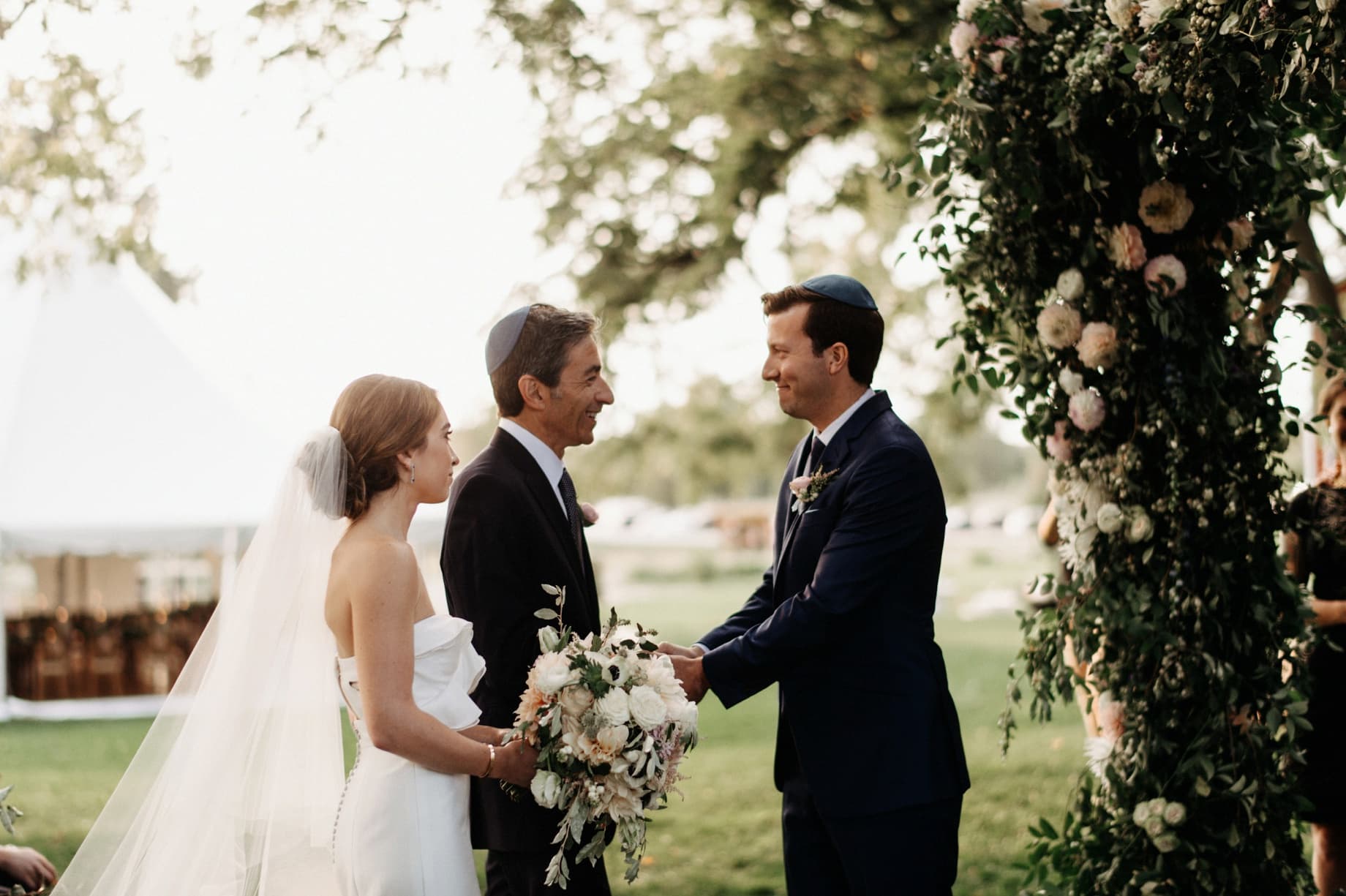 father of the bride giving his daughter away