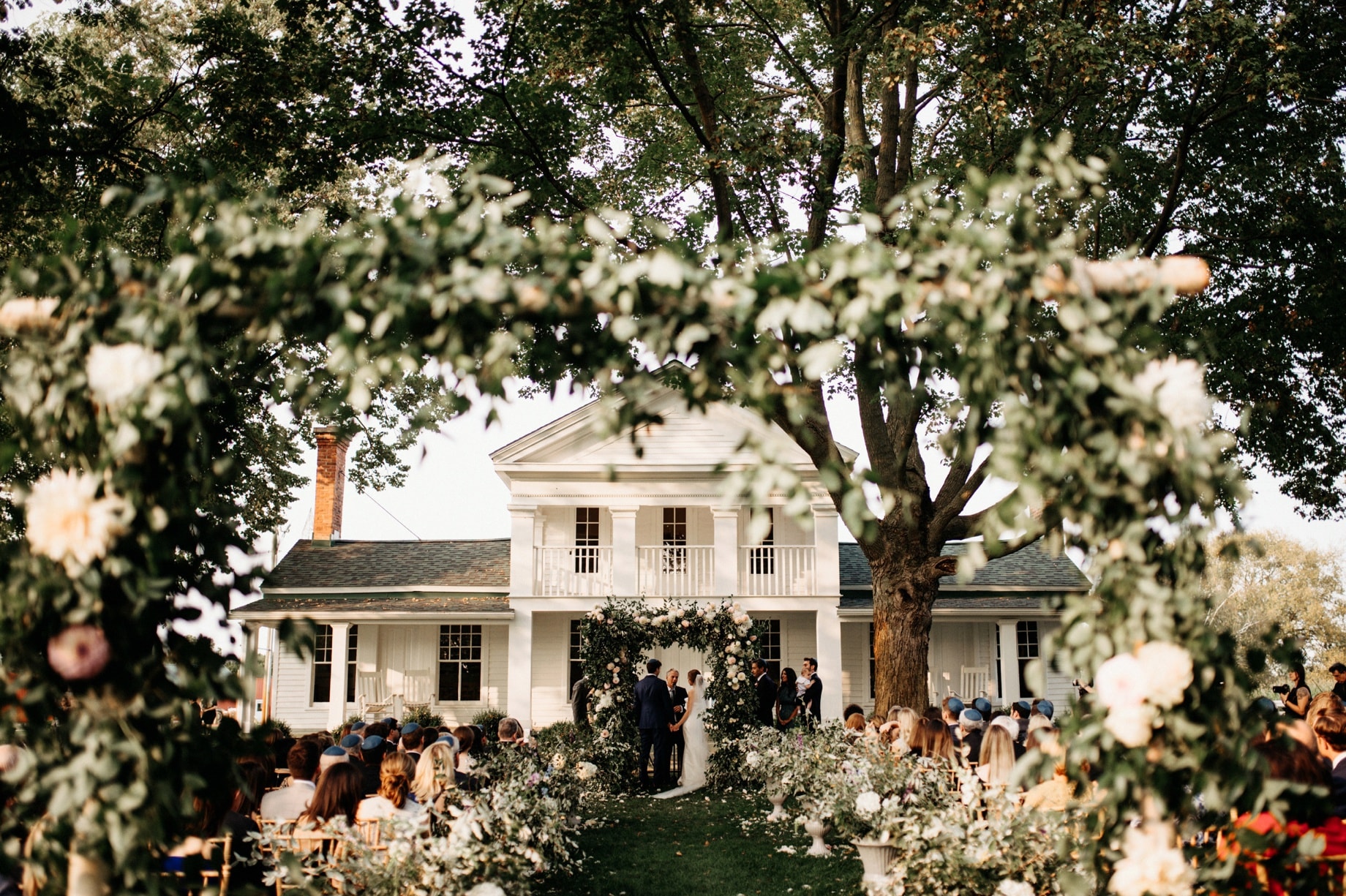 jewish wedding ceremony on the front lawn of cornman farms by ann arbor wedding photographer heather jowett